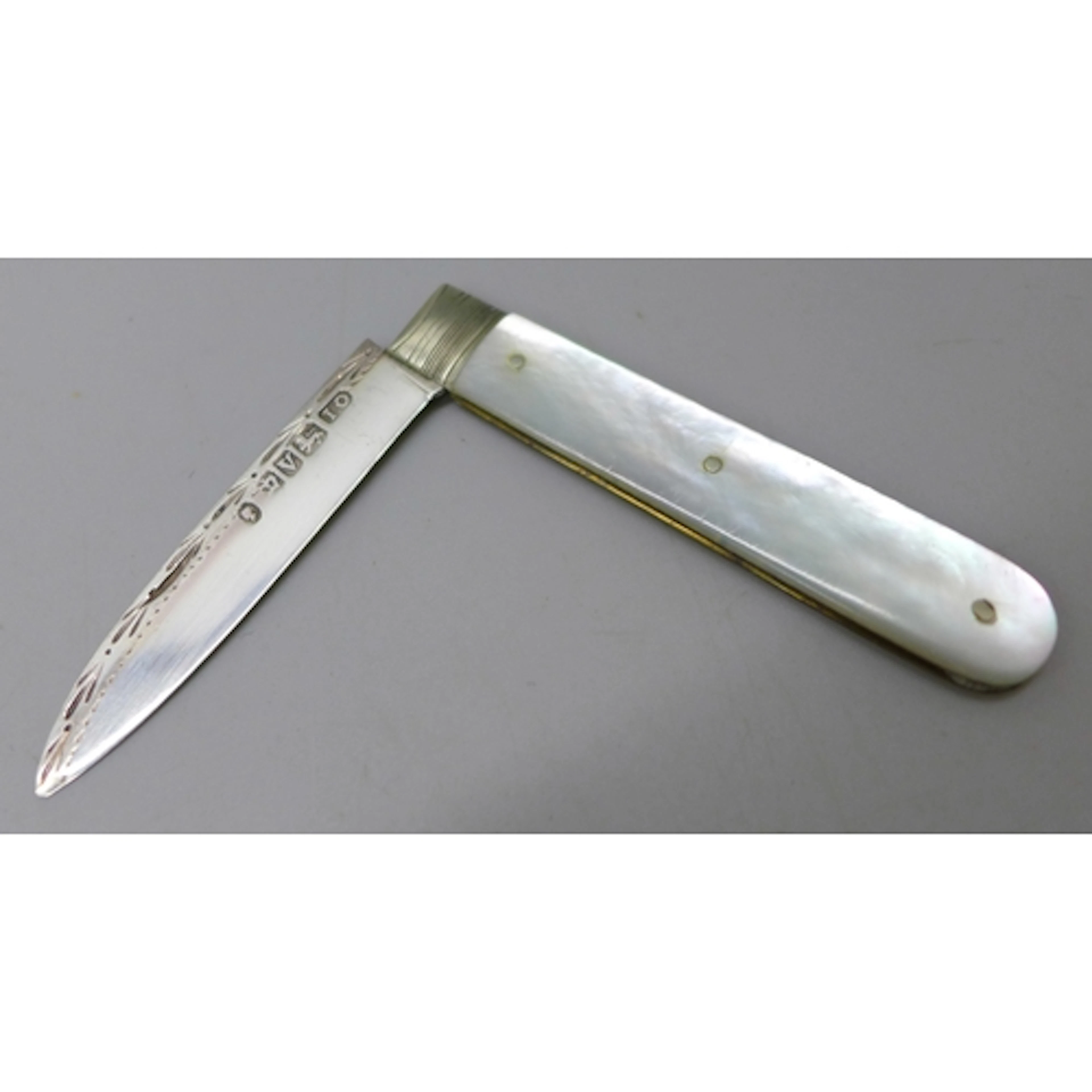A small Victorian carved mother of pearl fruit knife with a ...