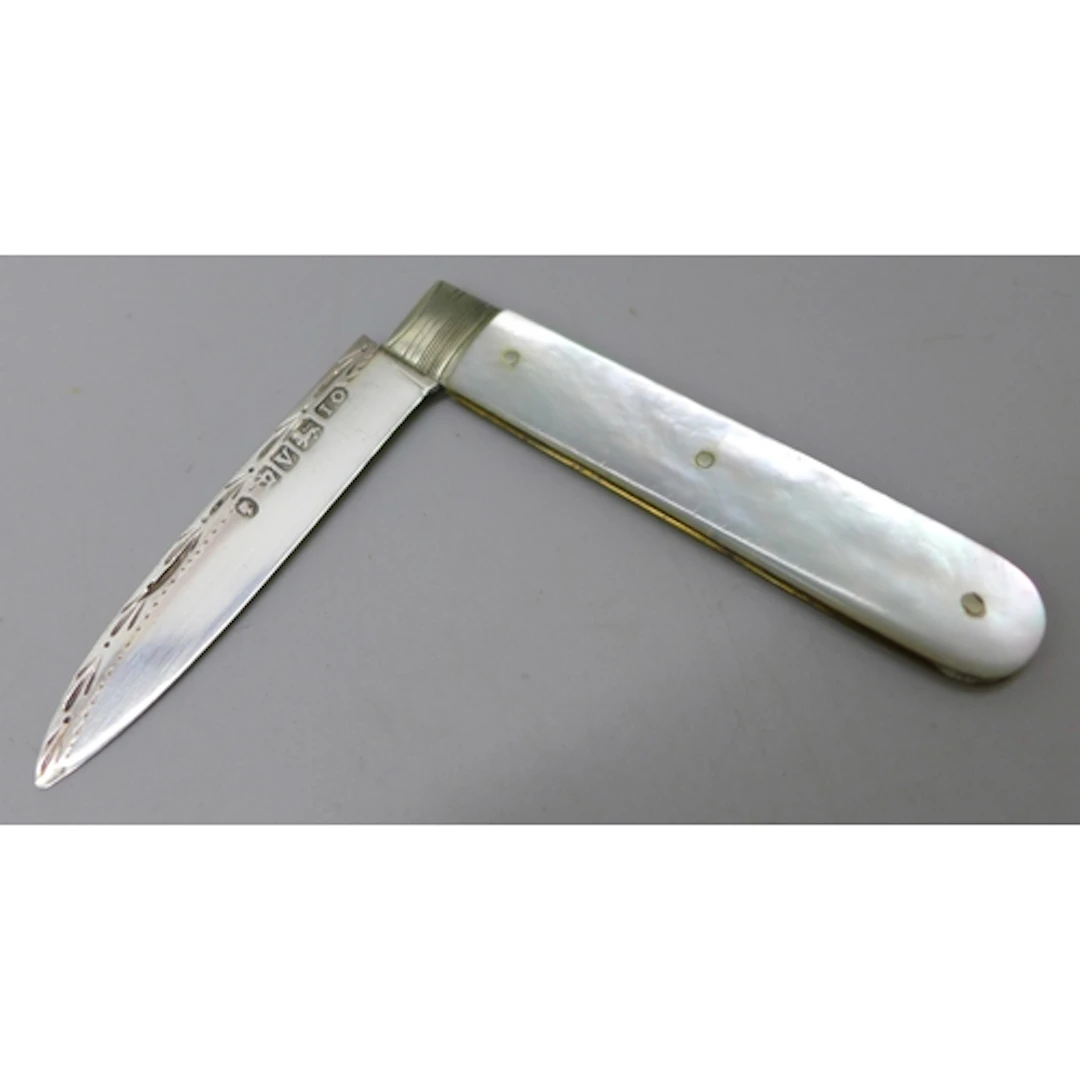 A small Victorian carved mother of pearl fruit knife with a ...