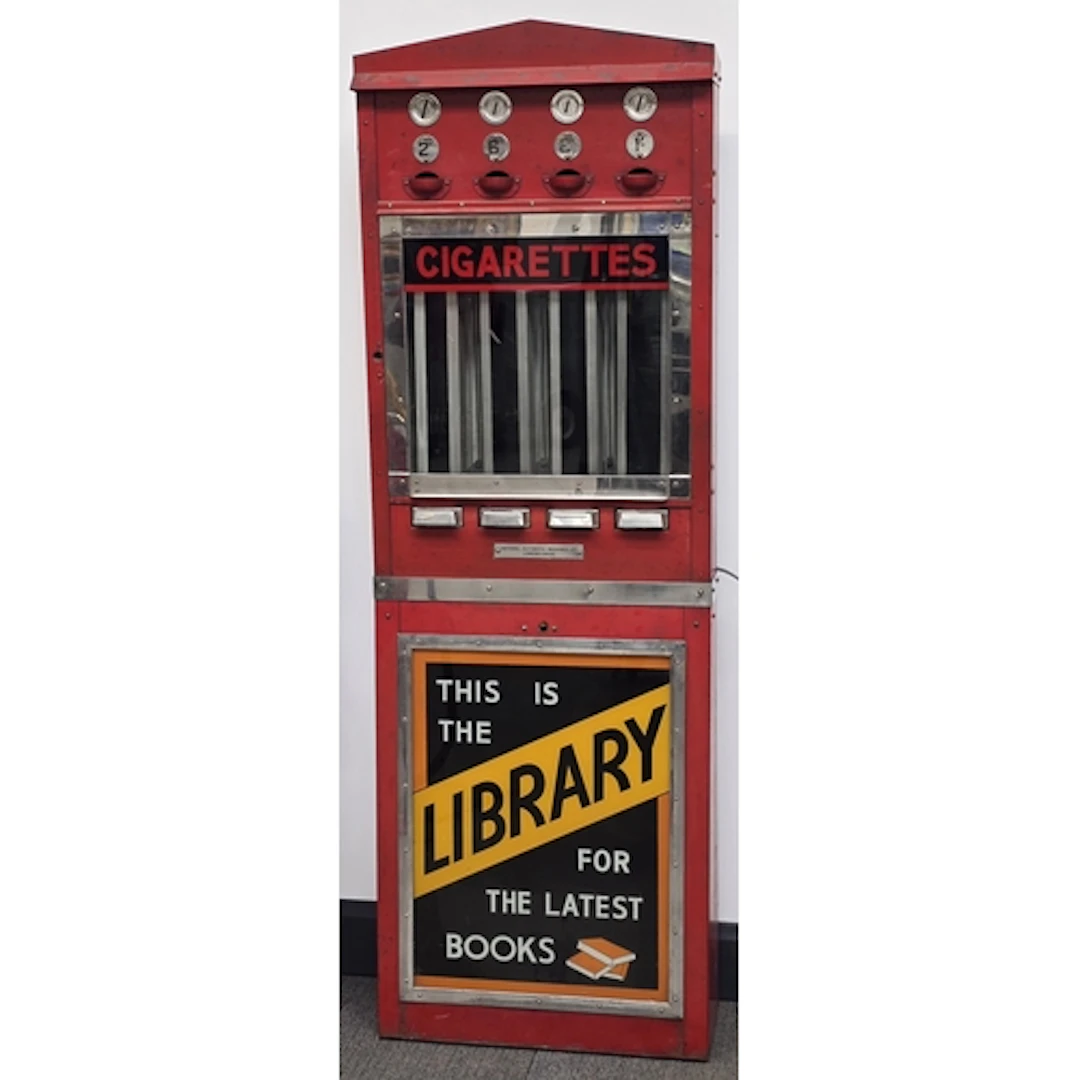 Vintage freestanding red metal cigarette vending maching fea...