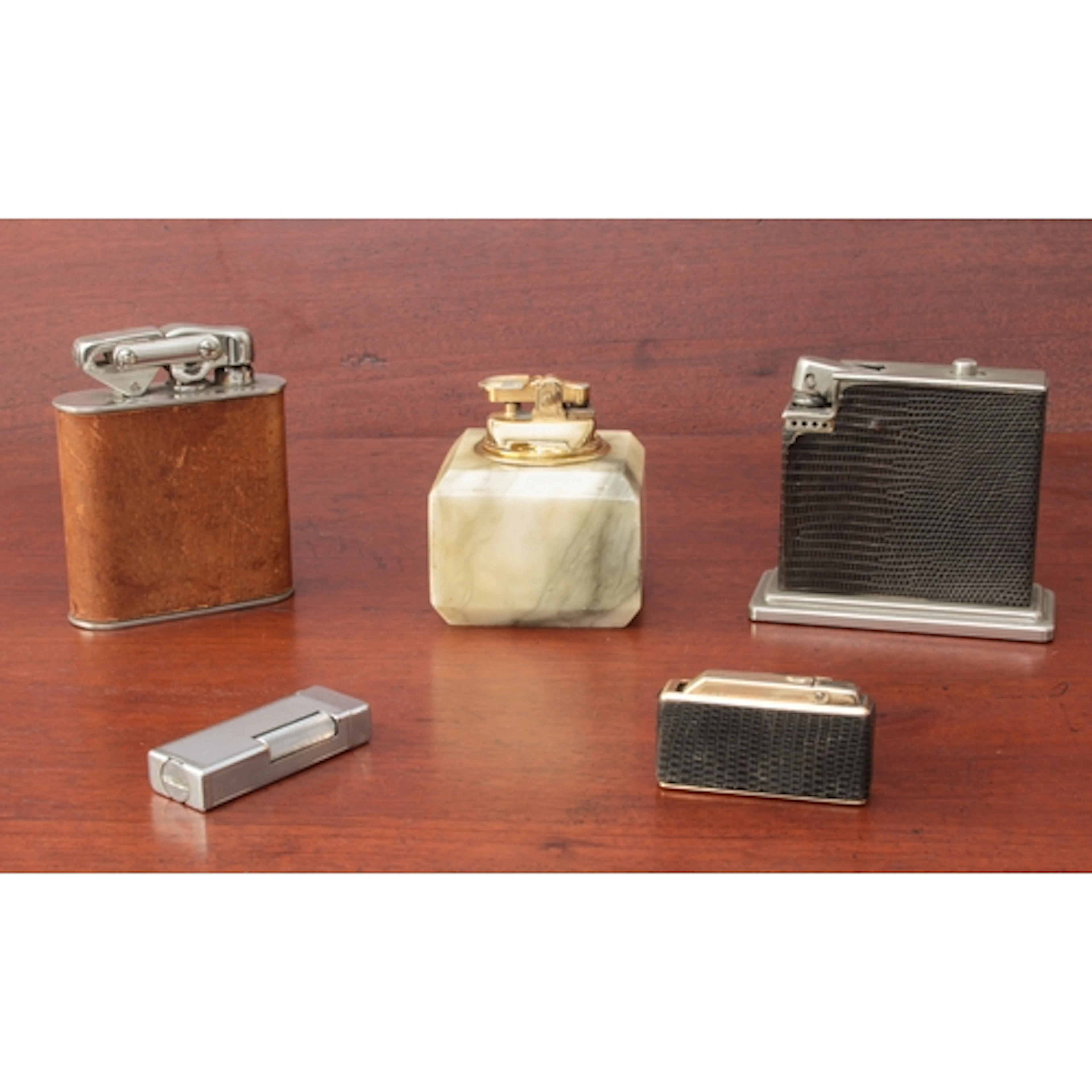 Three table and two pocket lighters: 1. a silver-plated Dun...