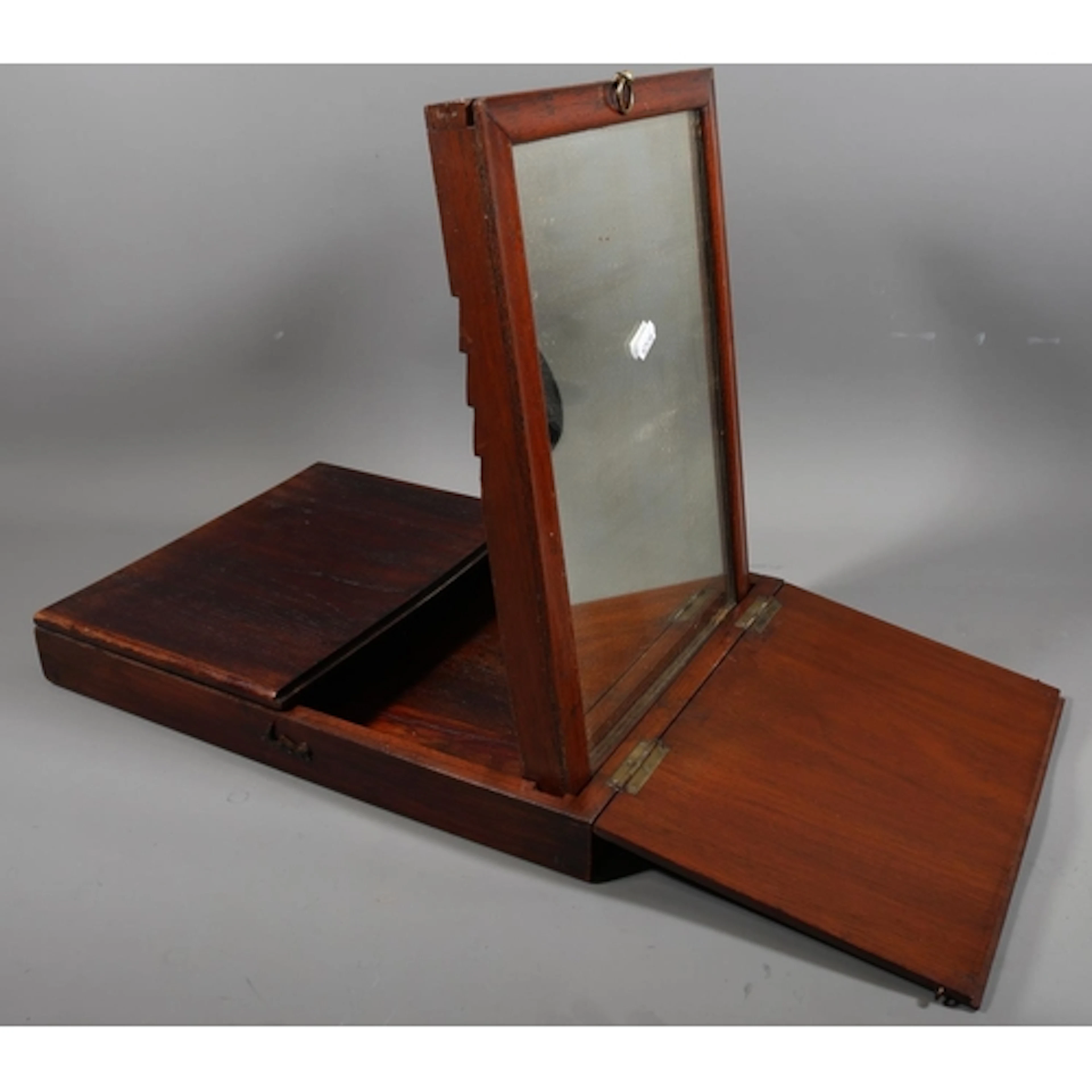 Mahogany travel mirror of rectangular form, 42cm x 31cm.