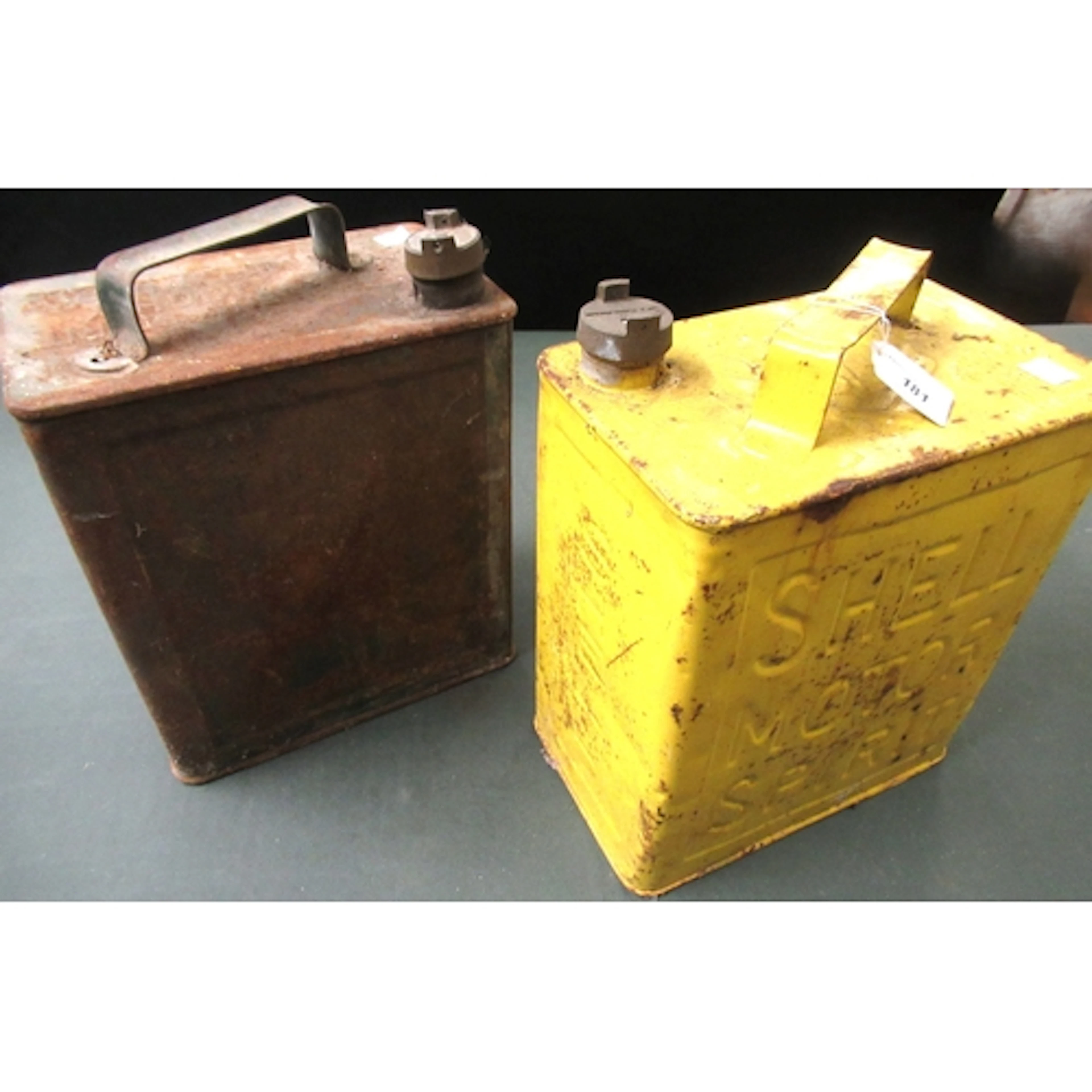 Shell painted metal petrol can together with another petrol ...