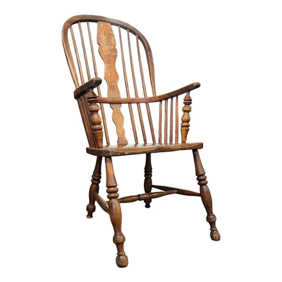 A 19th century Victorian beech and elm wood Windsor armchair...