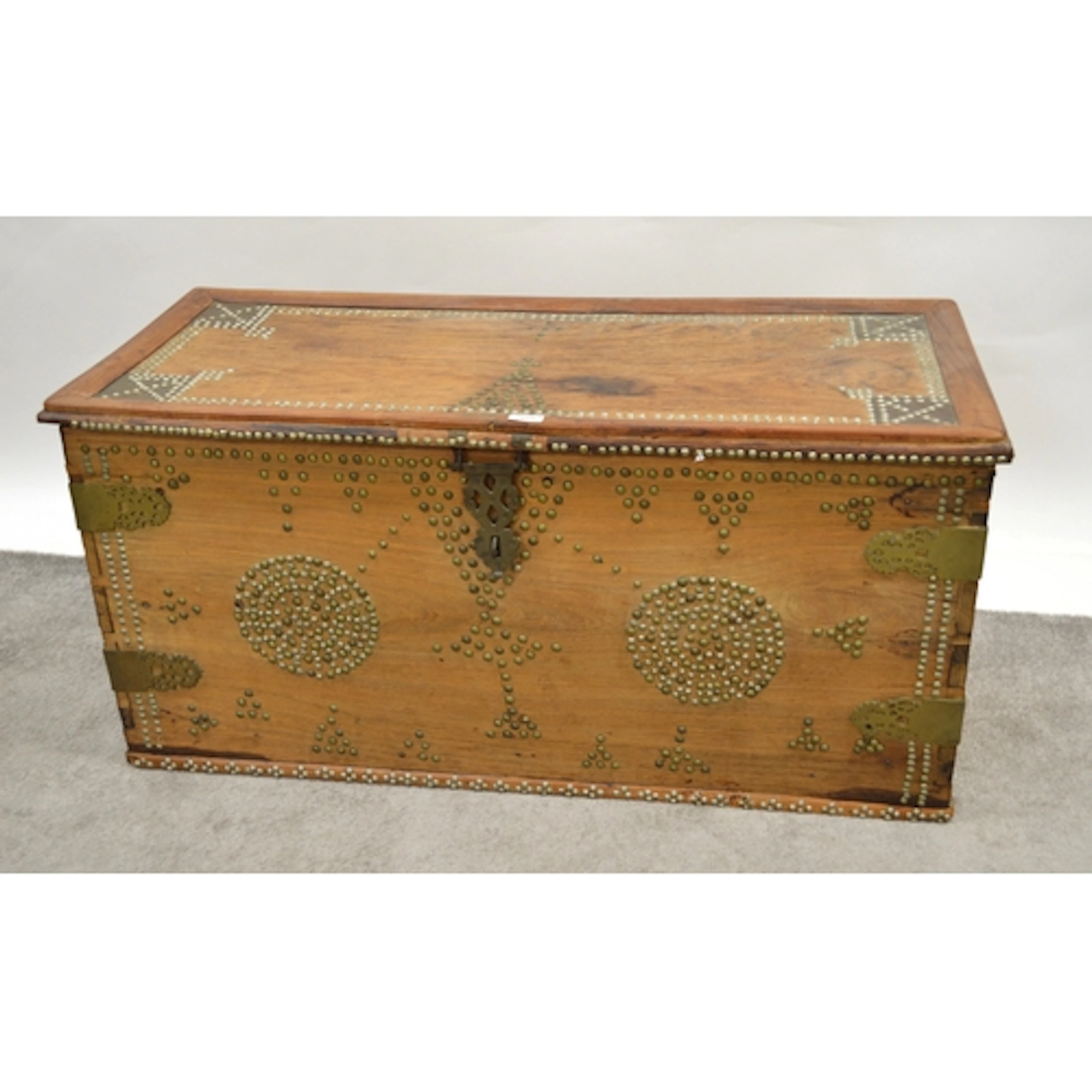 Middle Eastern brass mounted hardwood kist with hinged cover...