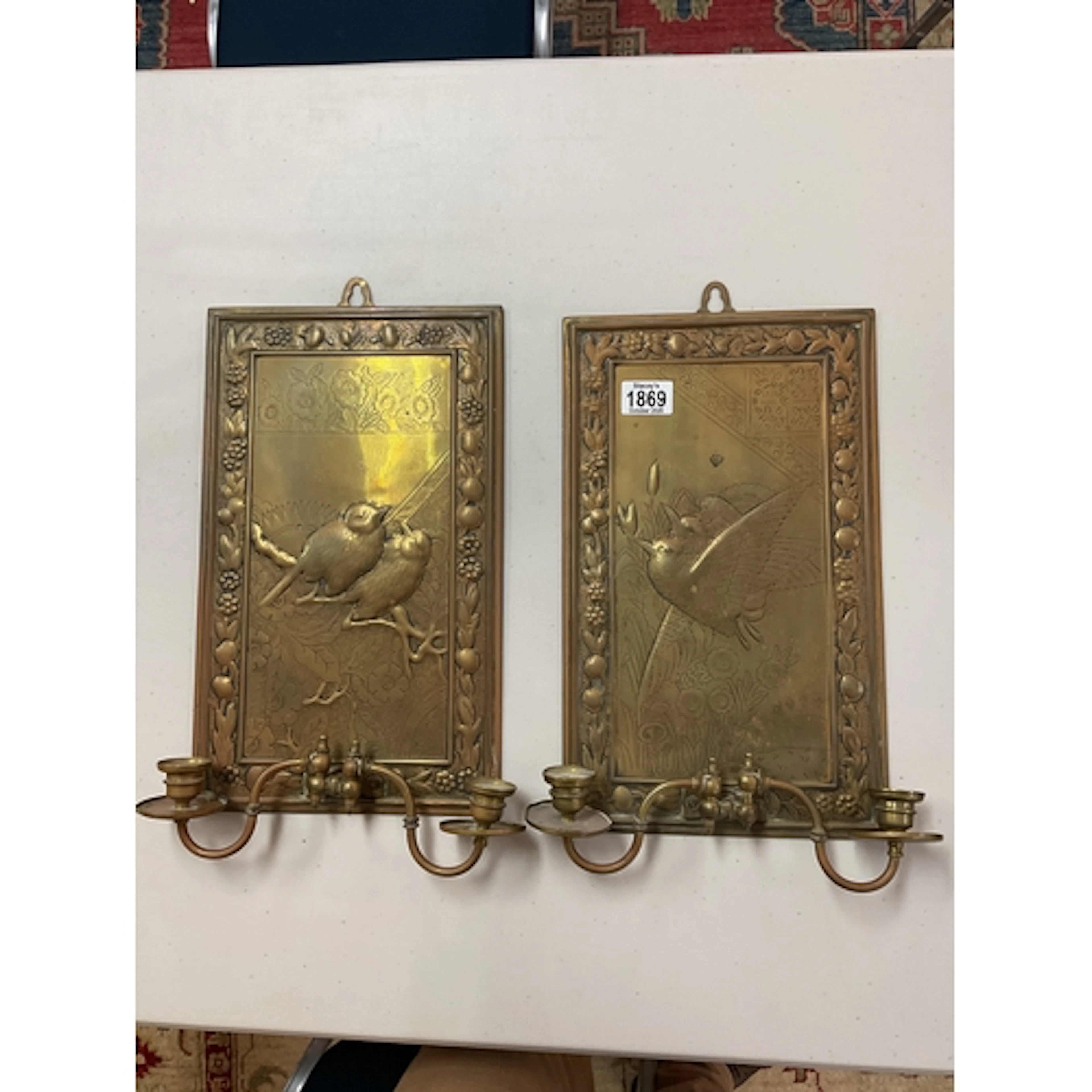 Pair ornate bird decorated brass twin wall sconces