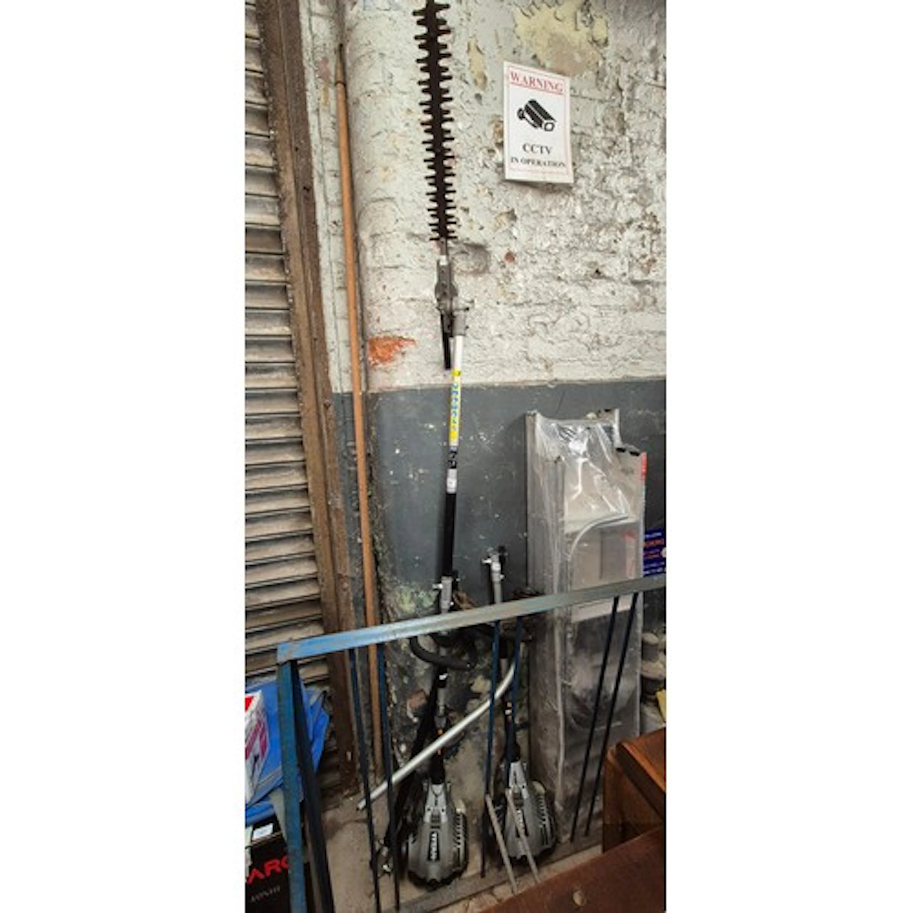 A Titan brush cutter and a Titan hedge trimmer (both extendi...