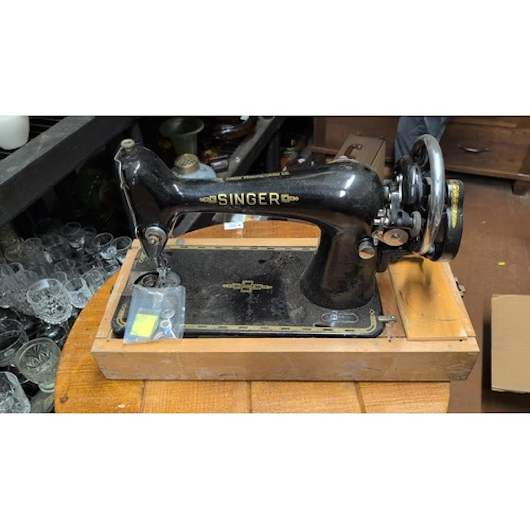 Singer black-enamel cast-iron sewing machine with gilt geome...