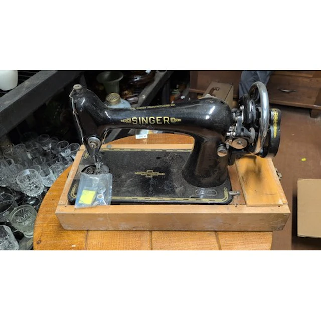Singer black-enamel cast-iron sewing machine with gilt geome...
