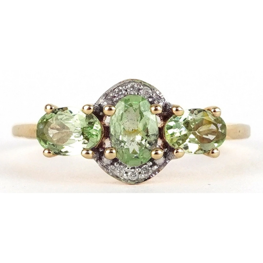 10k gold diamond and green stone ring, possibly peridot, siz...