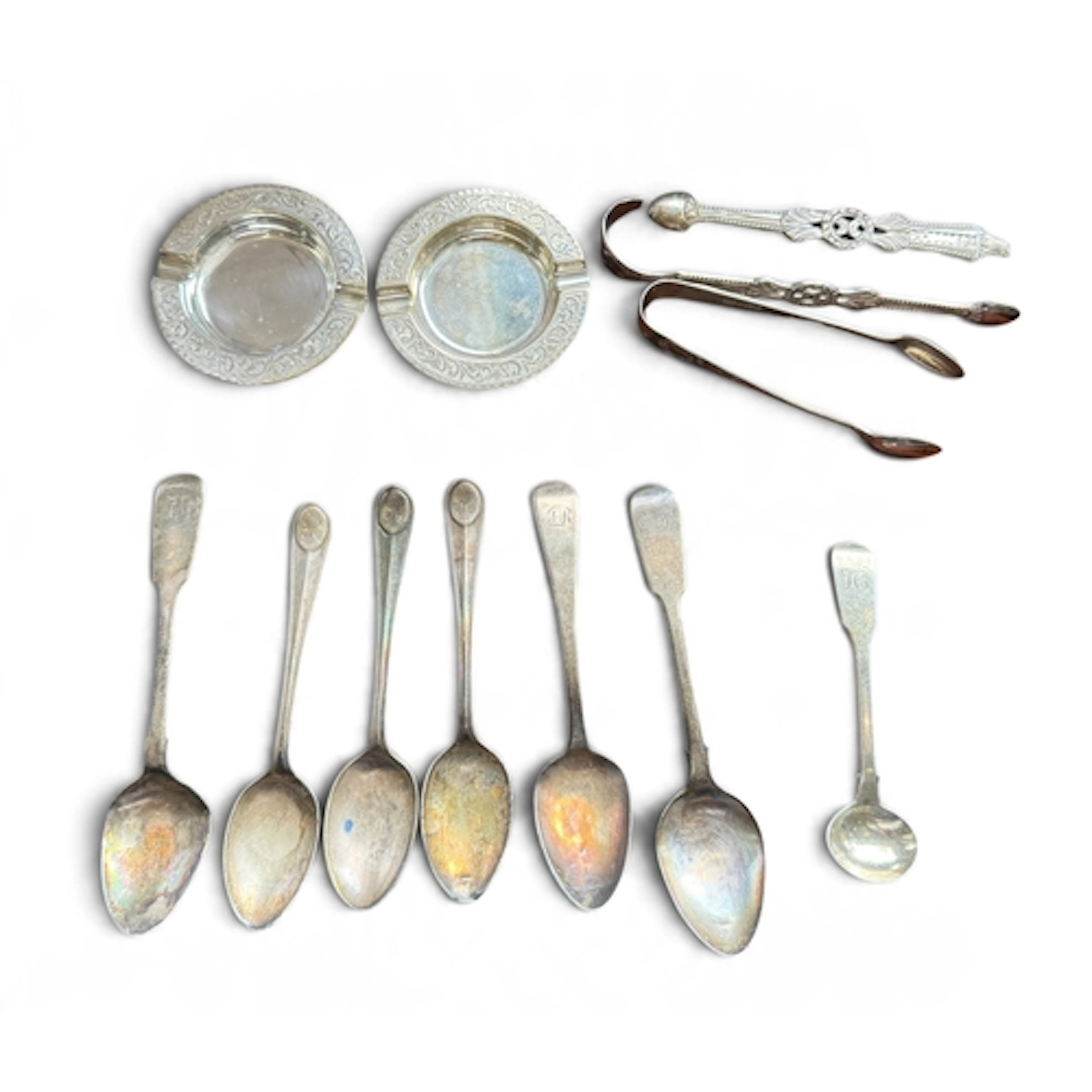 A PAIR OF SILVER ASHTRAYS Together with various tongs, teasp...