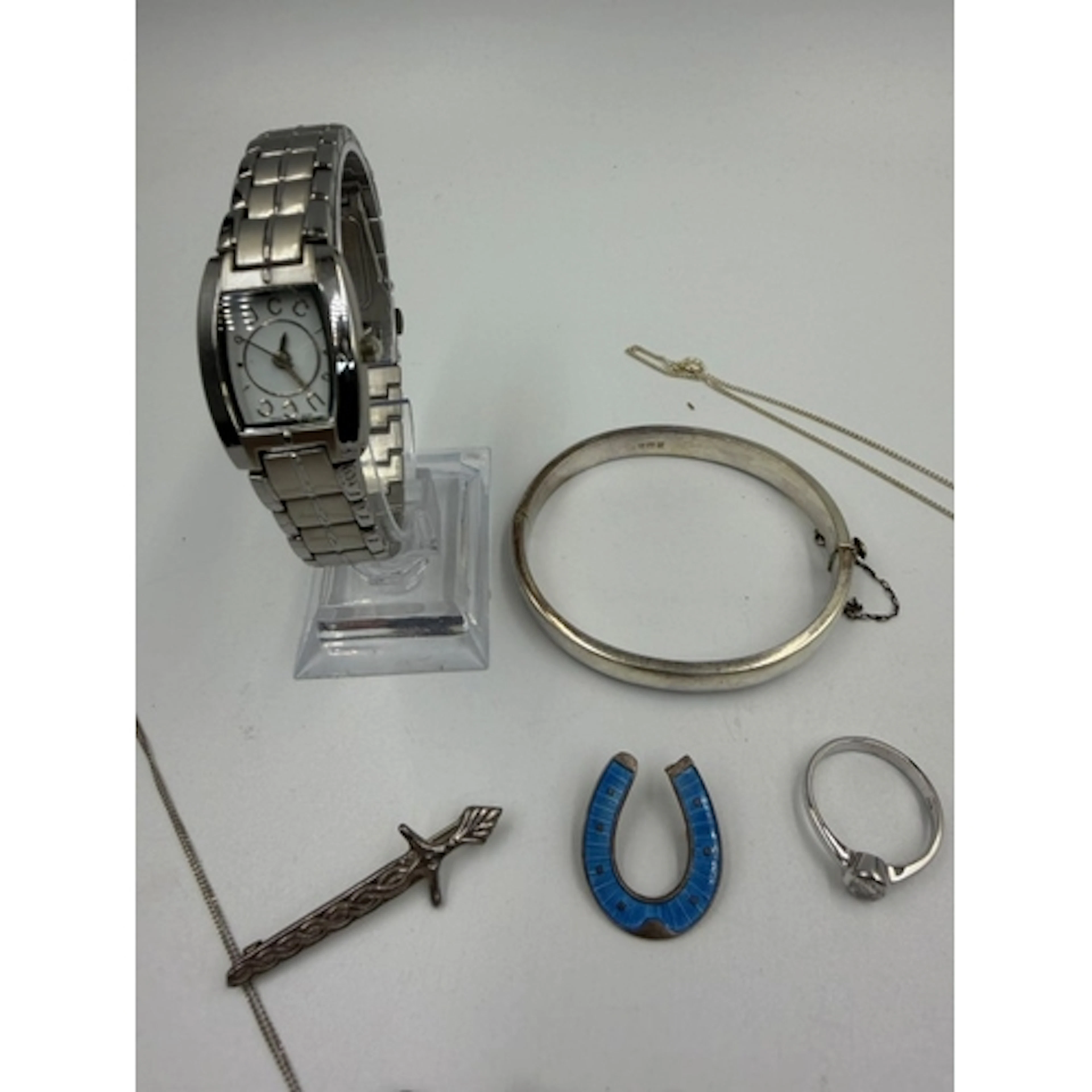 A selection of silver and costume jewellery, along with a Gu...