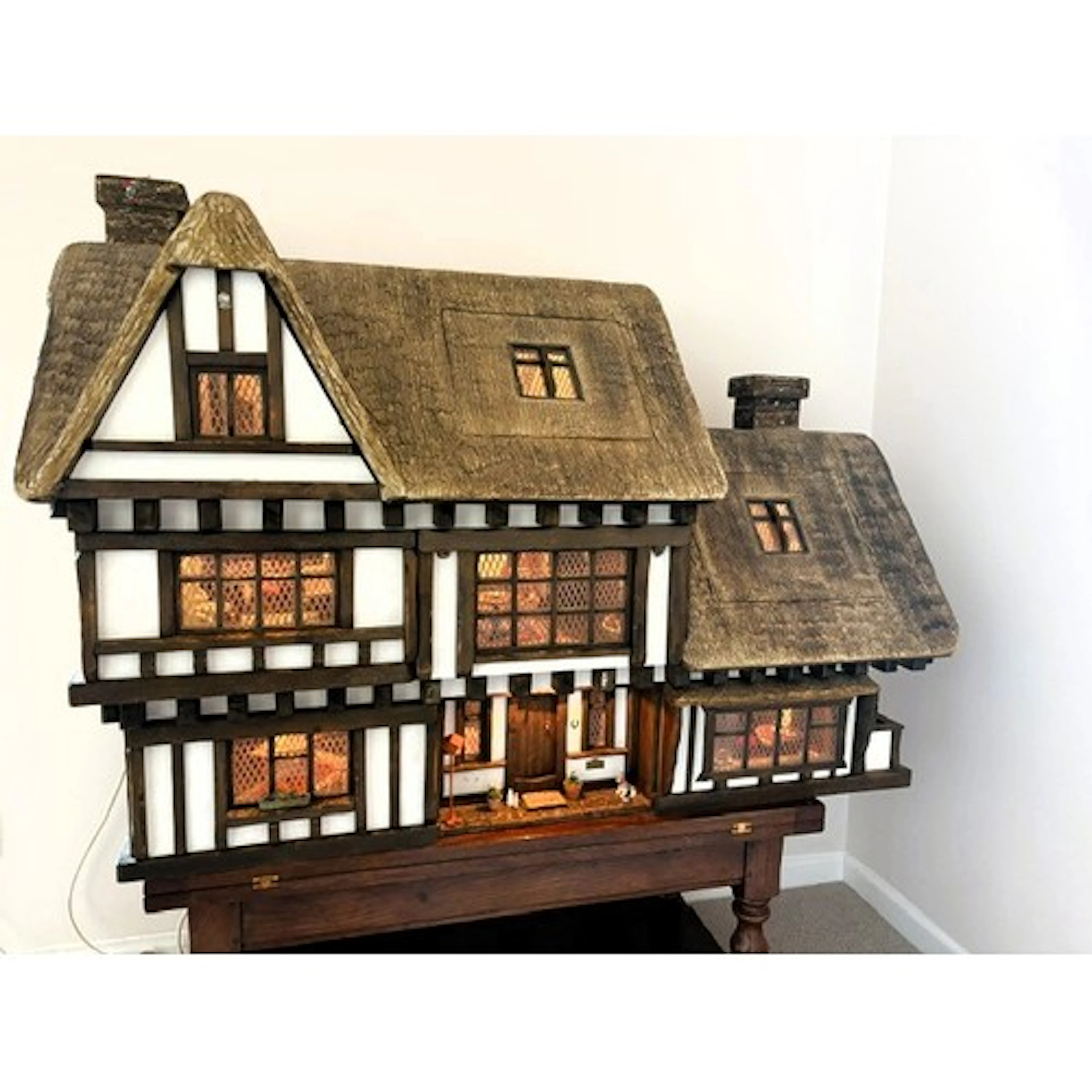 A large impressive Robert Stubbs Tudor doll's house, with 8 ...