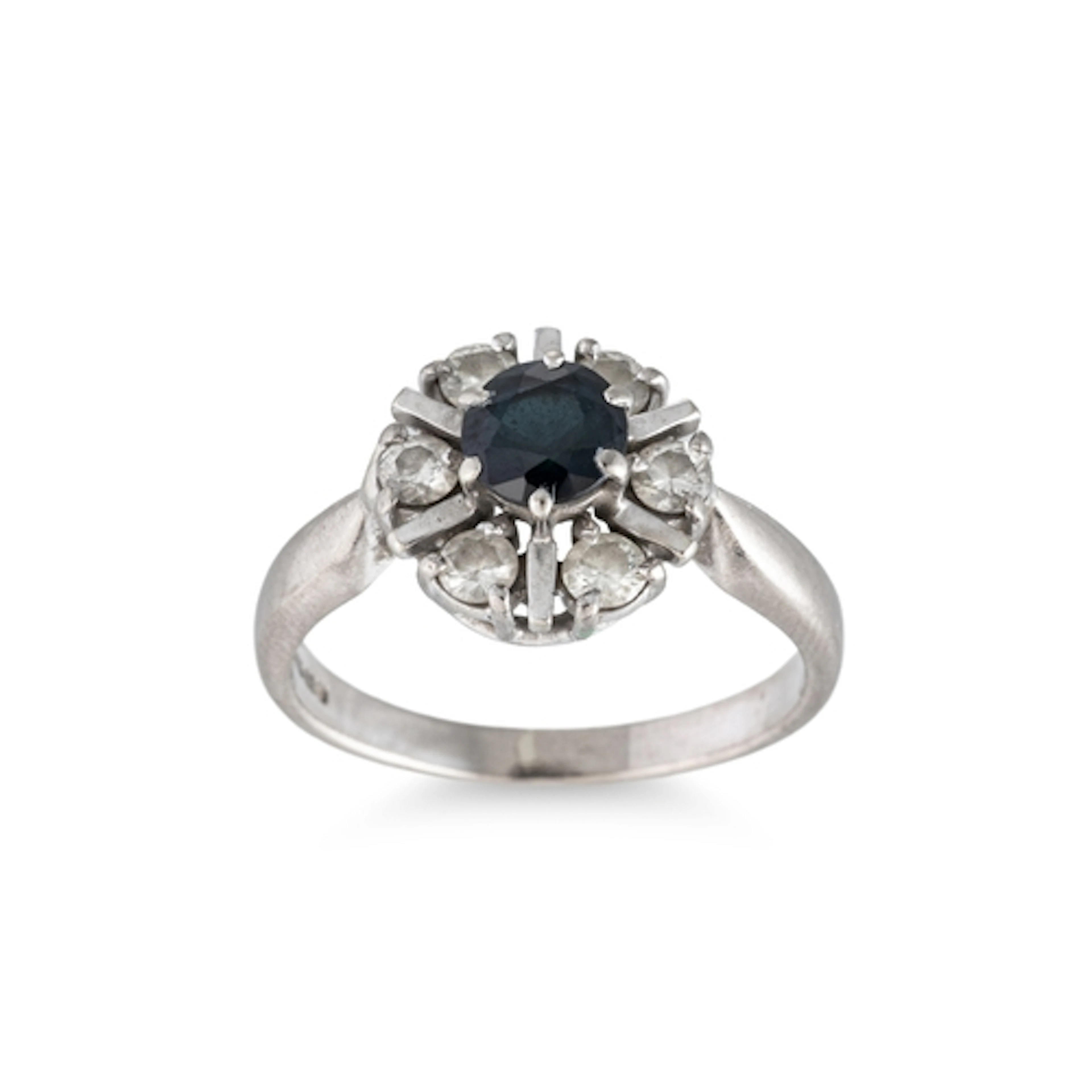 A SAPPHIRE AND DIAMOND CLUSTER RING, of circular form, mount...