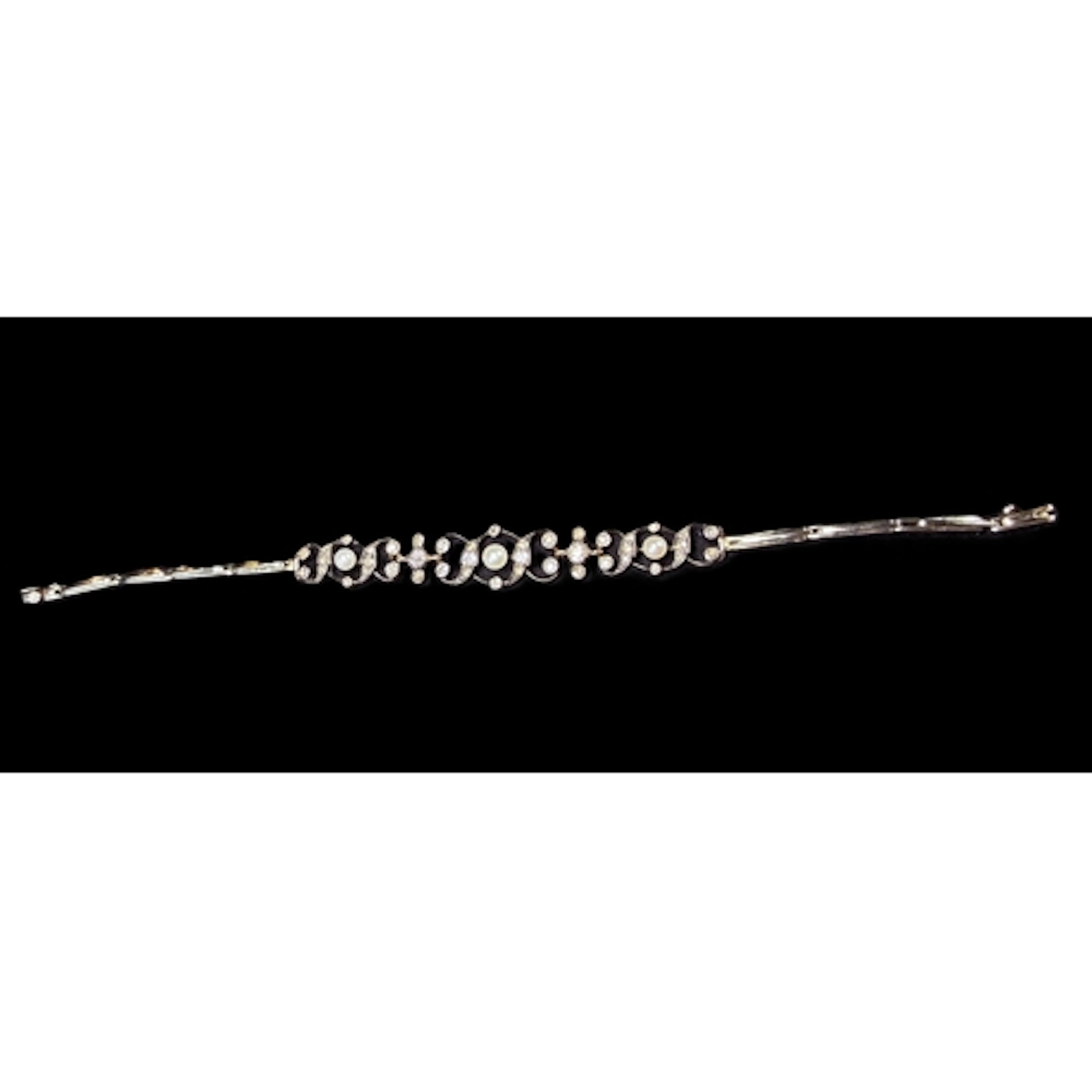 A white metal expanding bracelet set with diamonds and pearl...