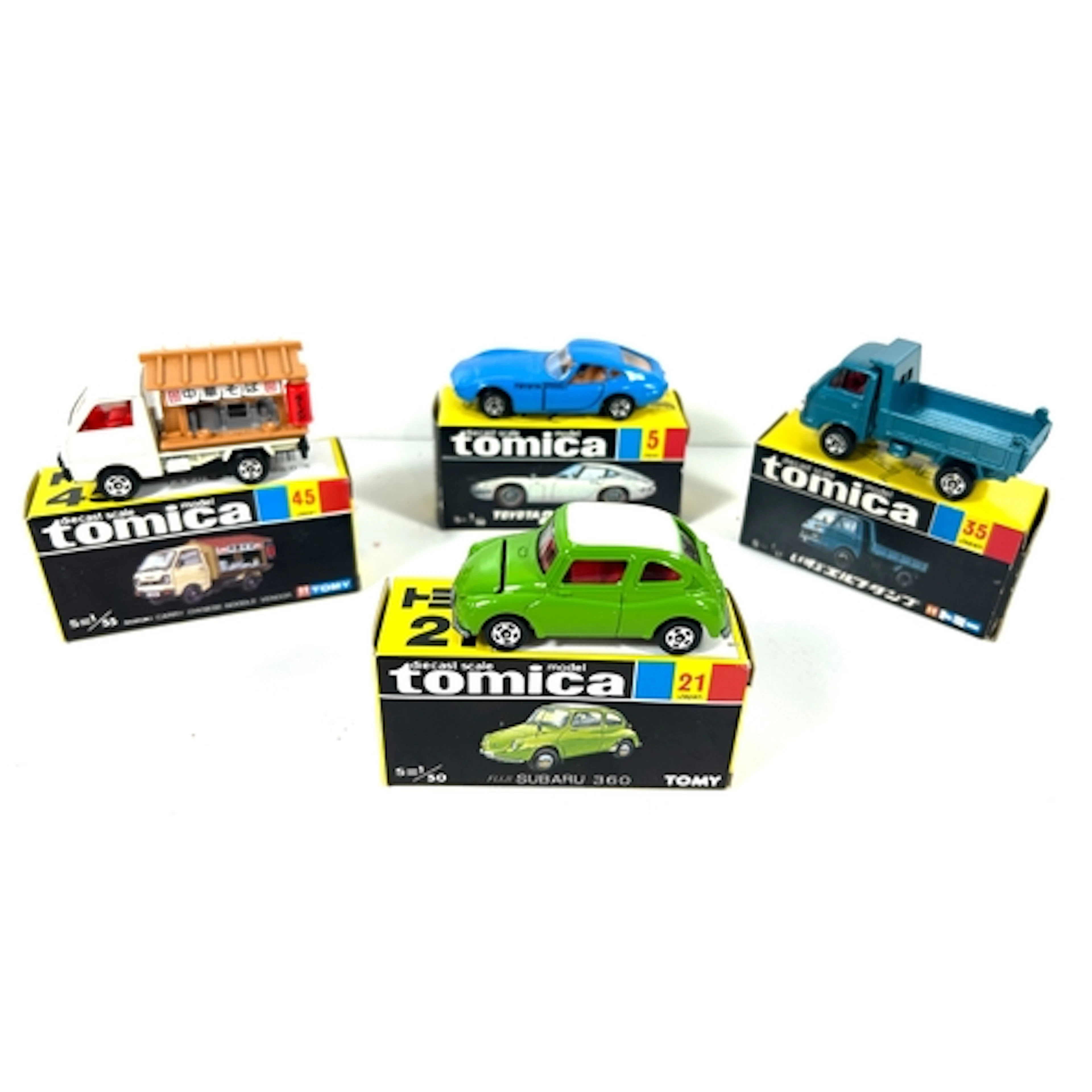 4 various scale Tomica. No.5 Toyota 2000GT. No.21 Subaru 360...