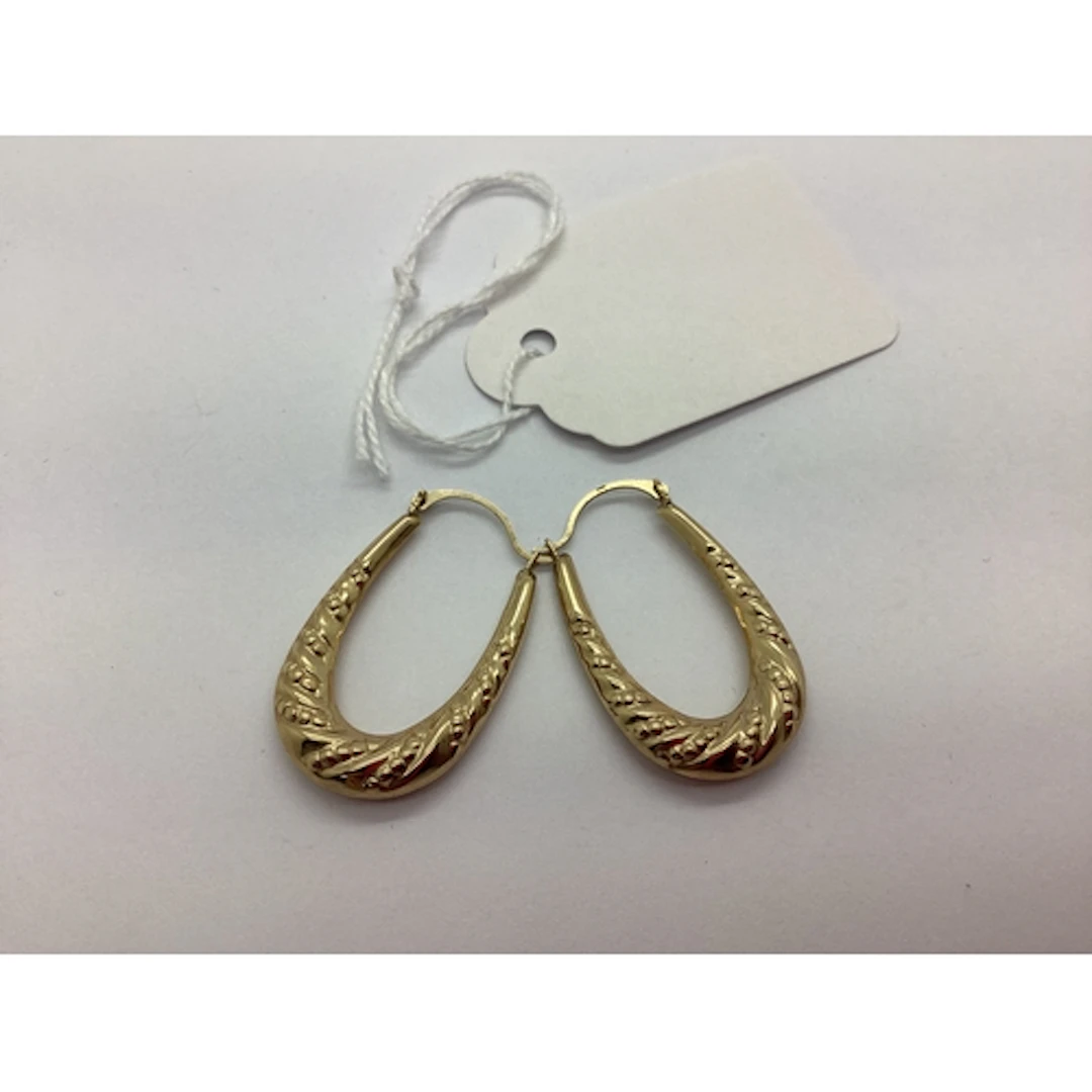A Pair of Modern Creole Earrings, of textured design, stampe...