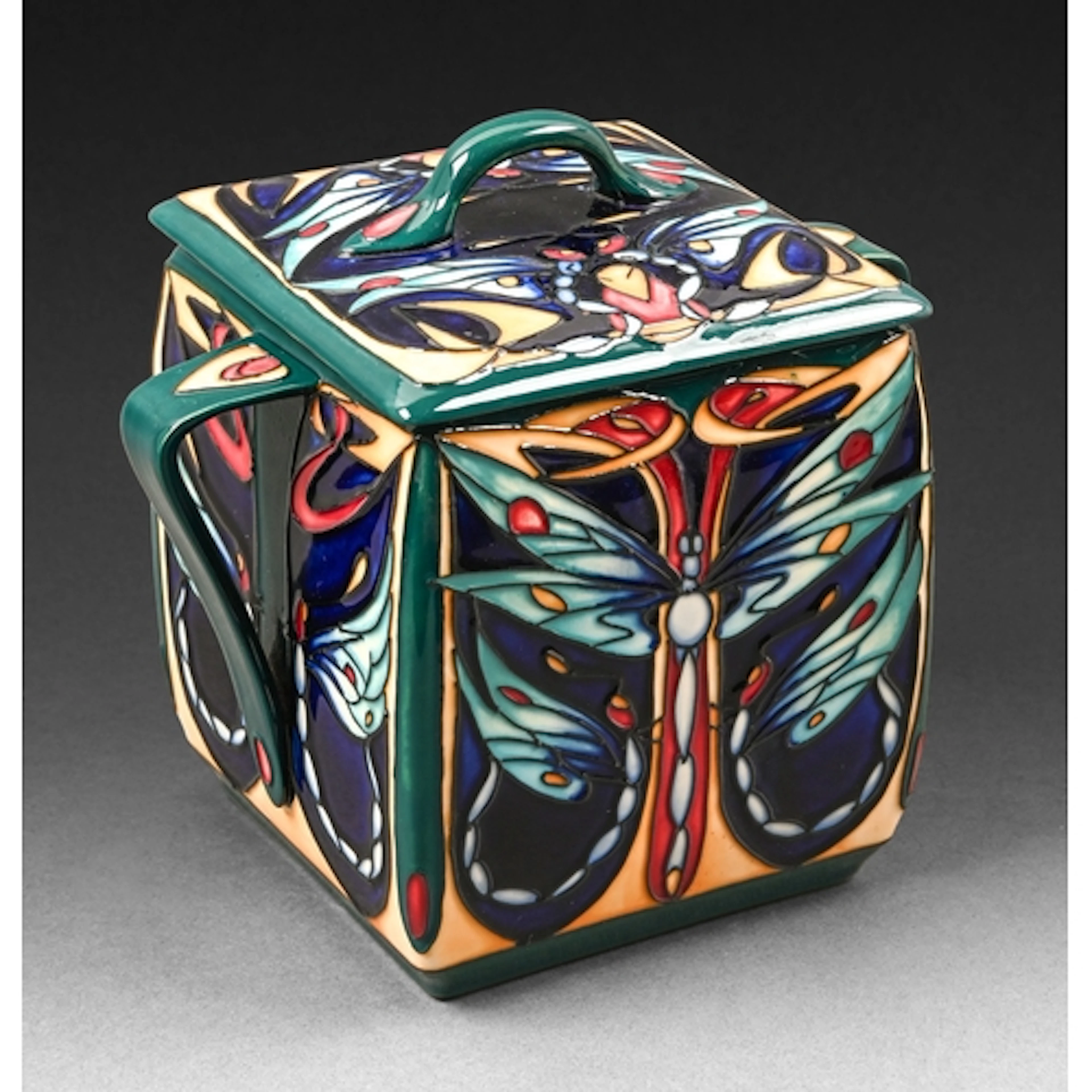 A Moorcroft Carolean biscuit jar and cover, designed by Rach...