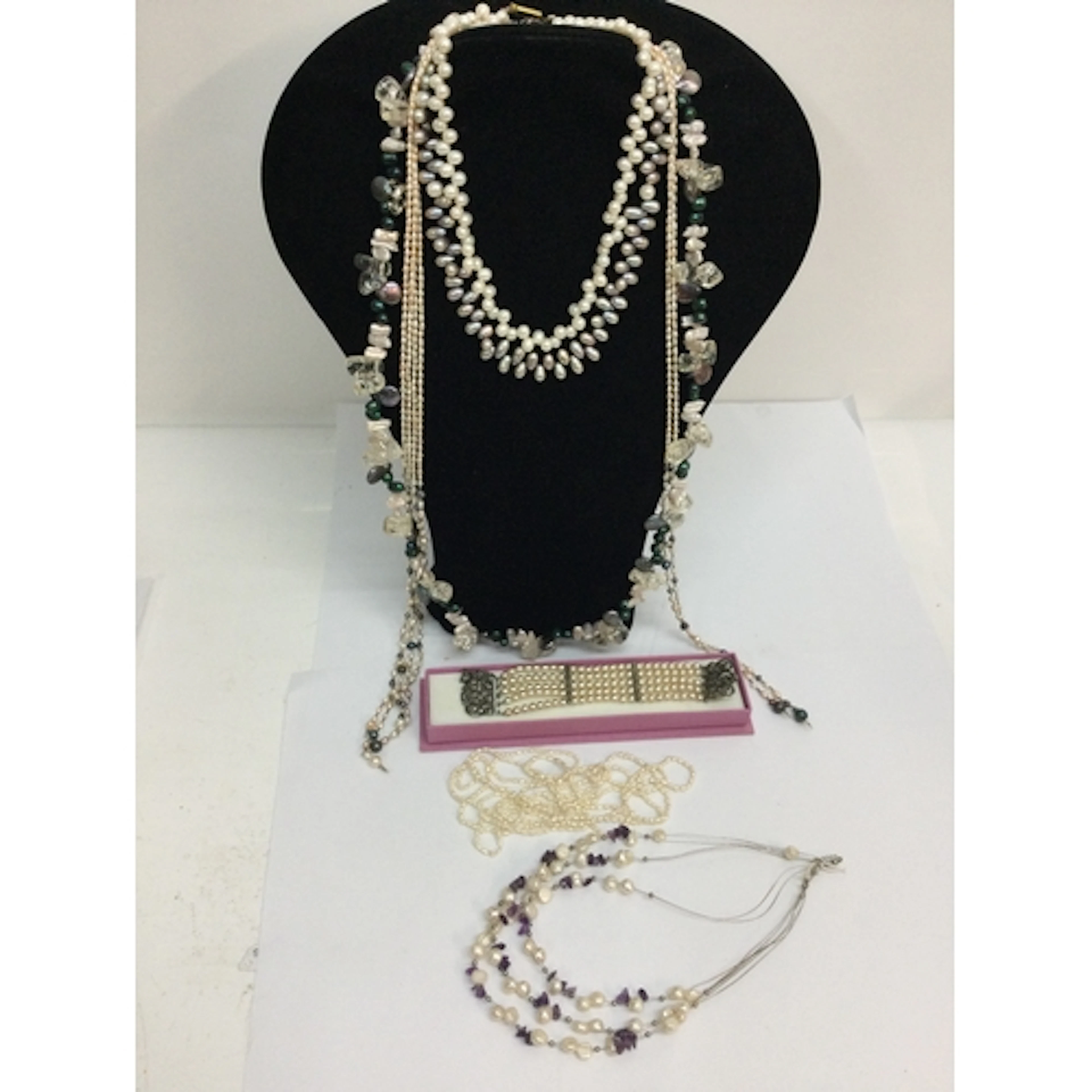 A cultured, coloured pearl choker necklace with silver clasp...