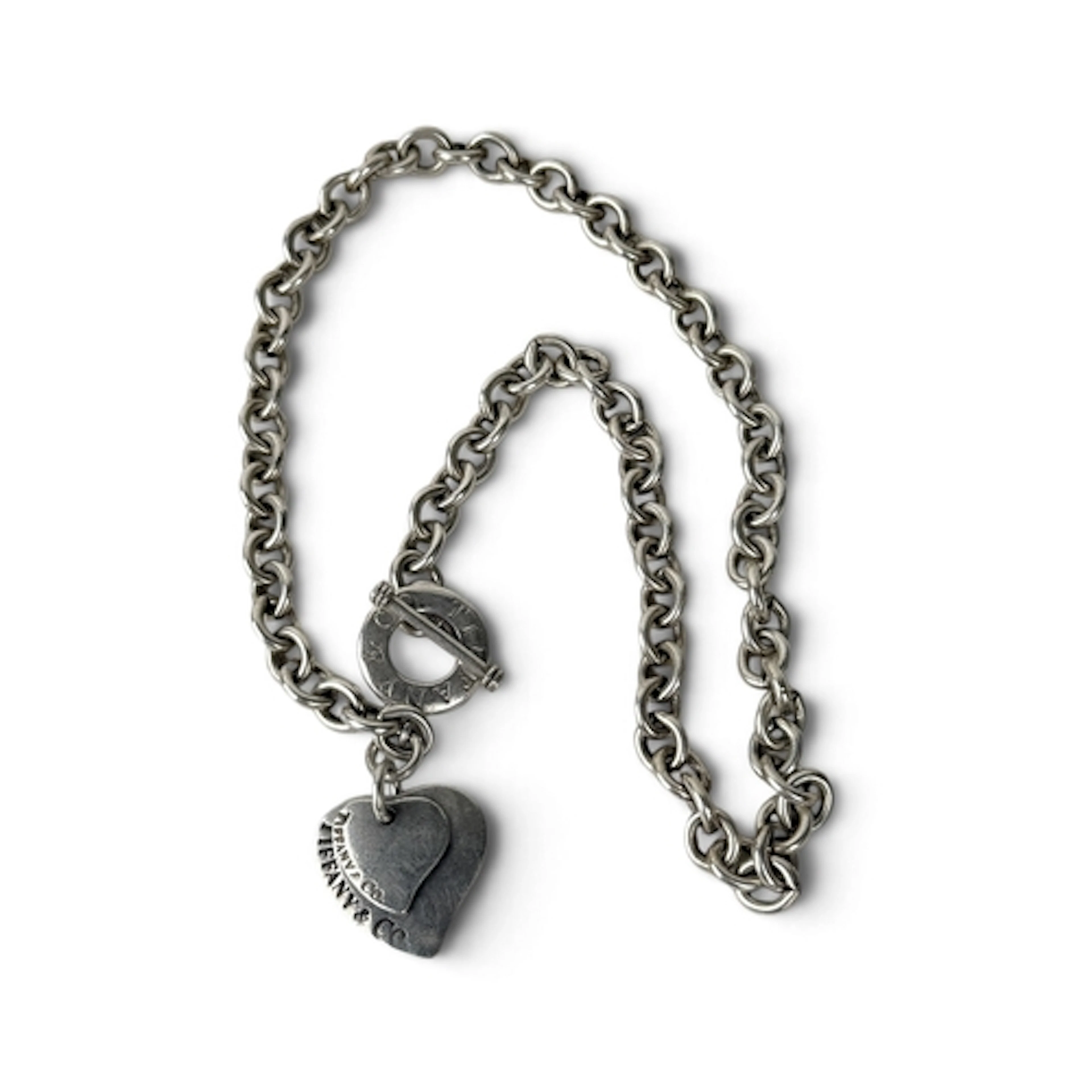 A TIFFANY AND CO SILVER BRACELET With Tiffany and Co charm. ...