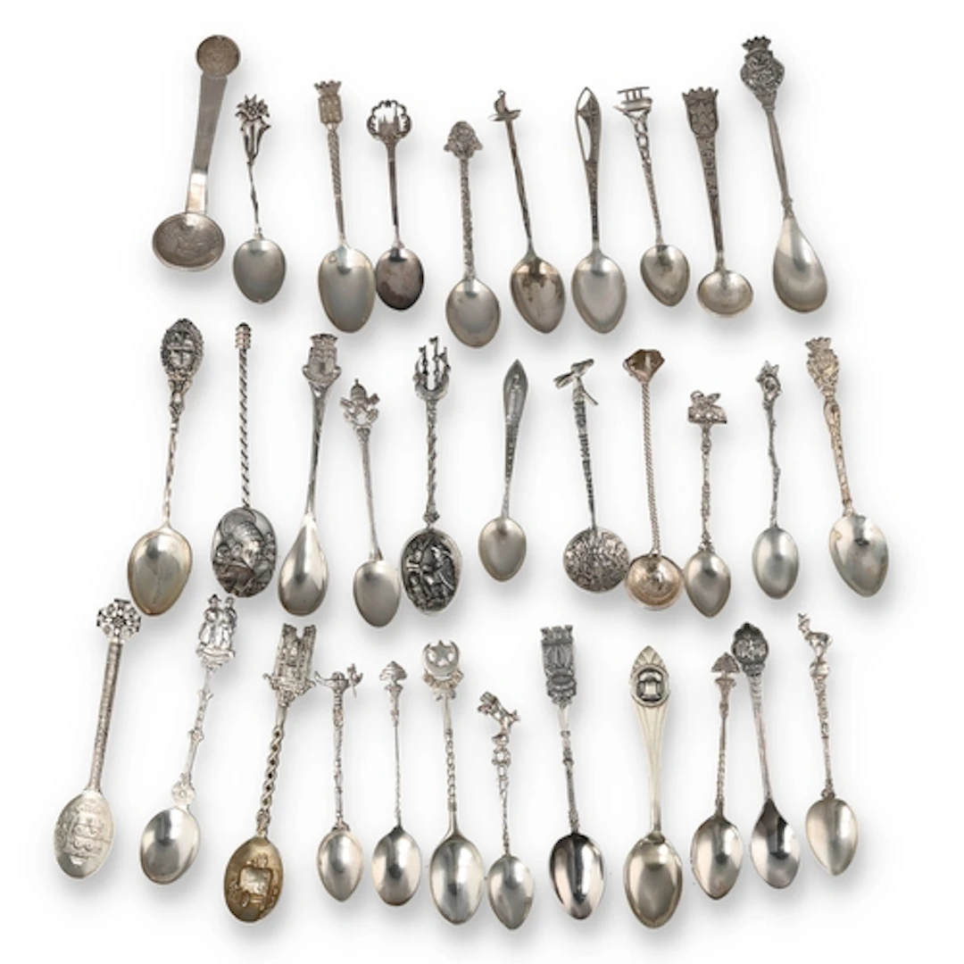 A COLLECTION OF THIRTY THREE EUROPEAN AND WORLD SILVER SOUVE...
