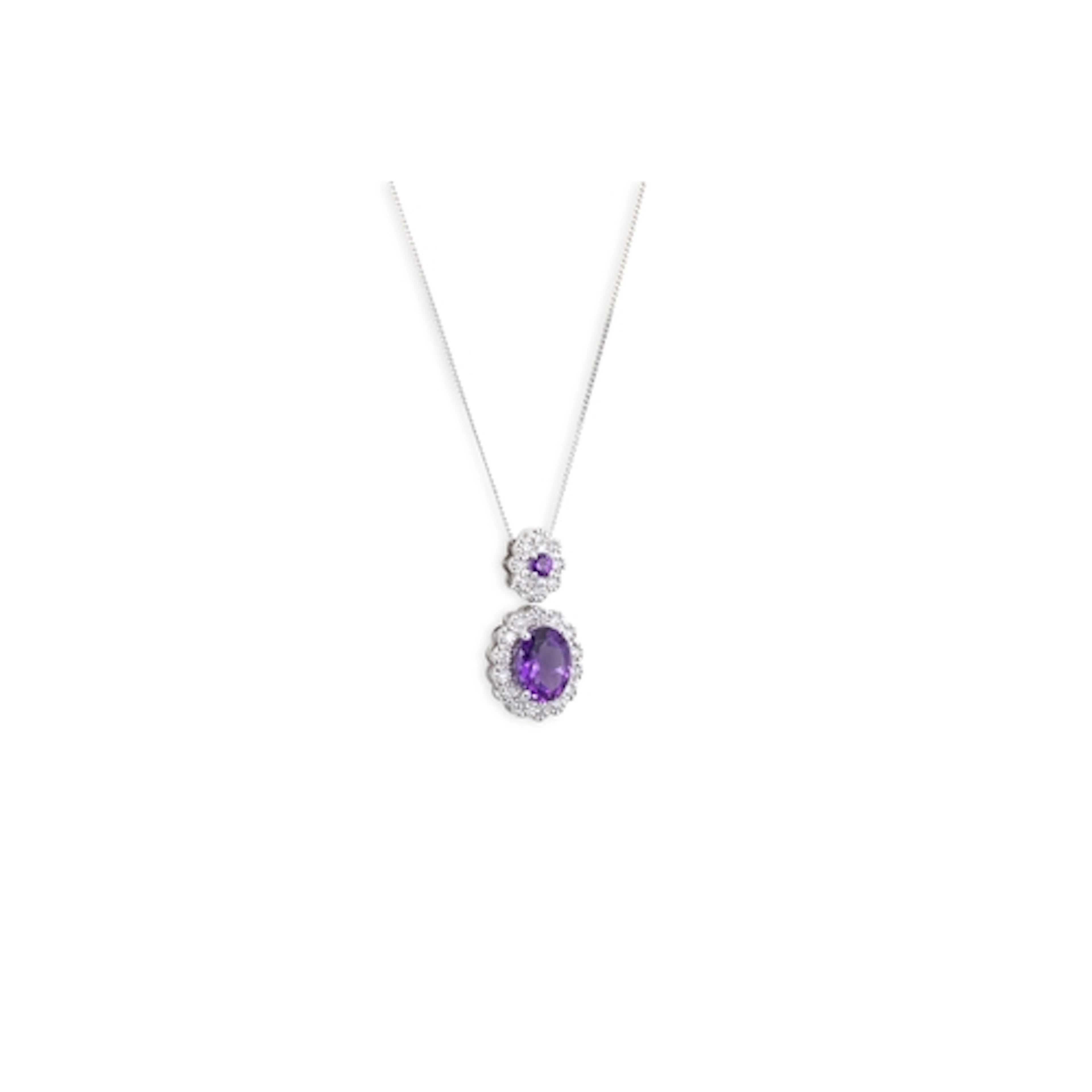 A DIAMOND AND AMETHYST PENDANT, the oval and round amethyst ...