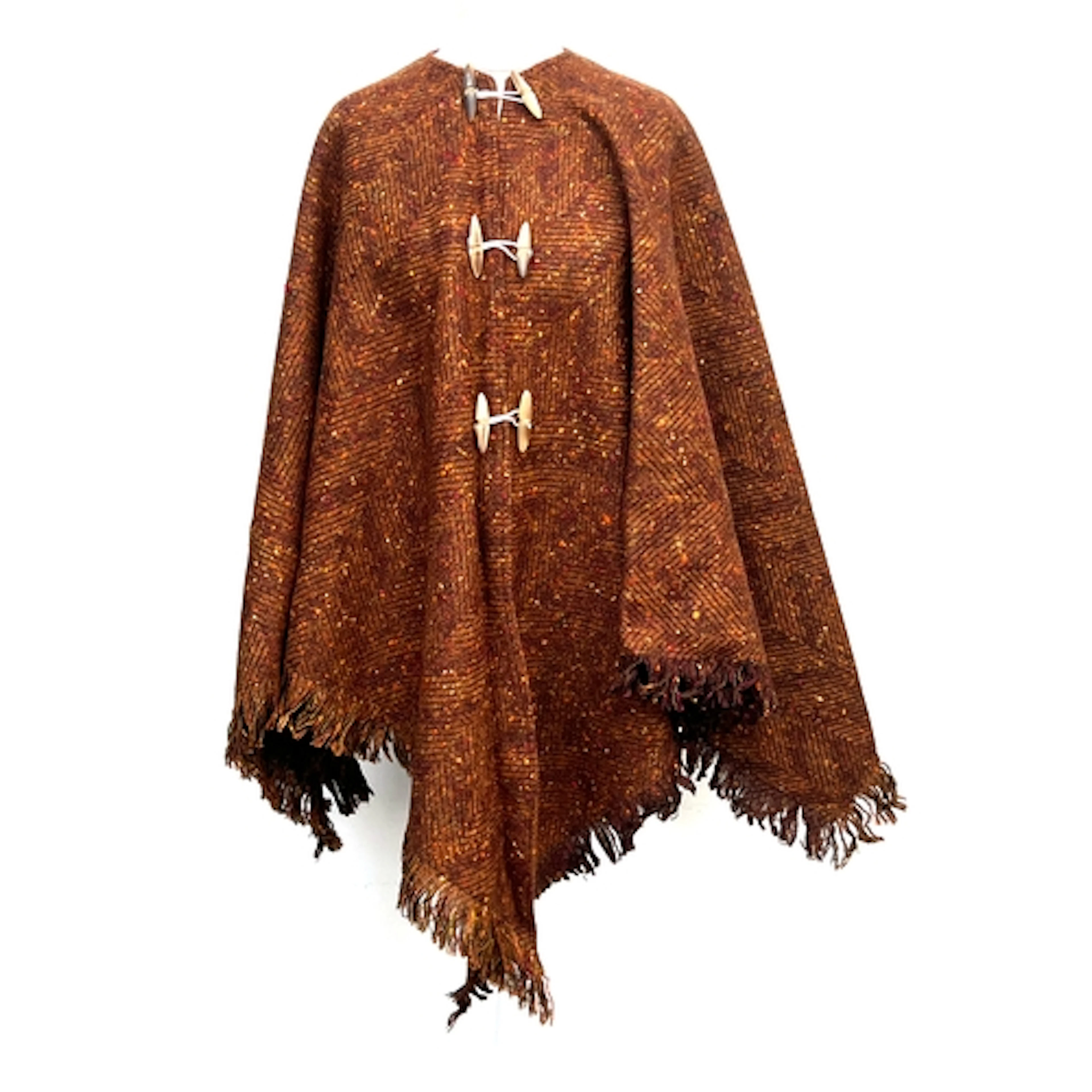 A brown wool poncho with horn toggles