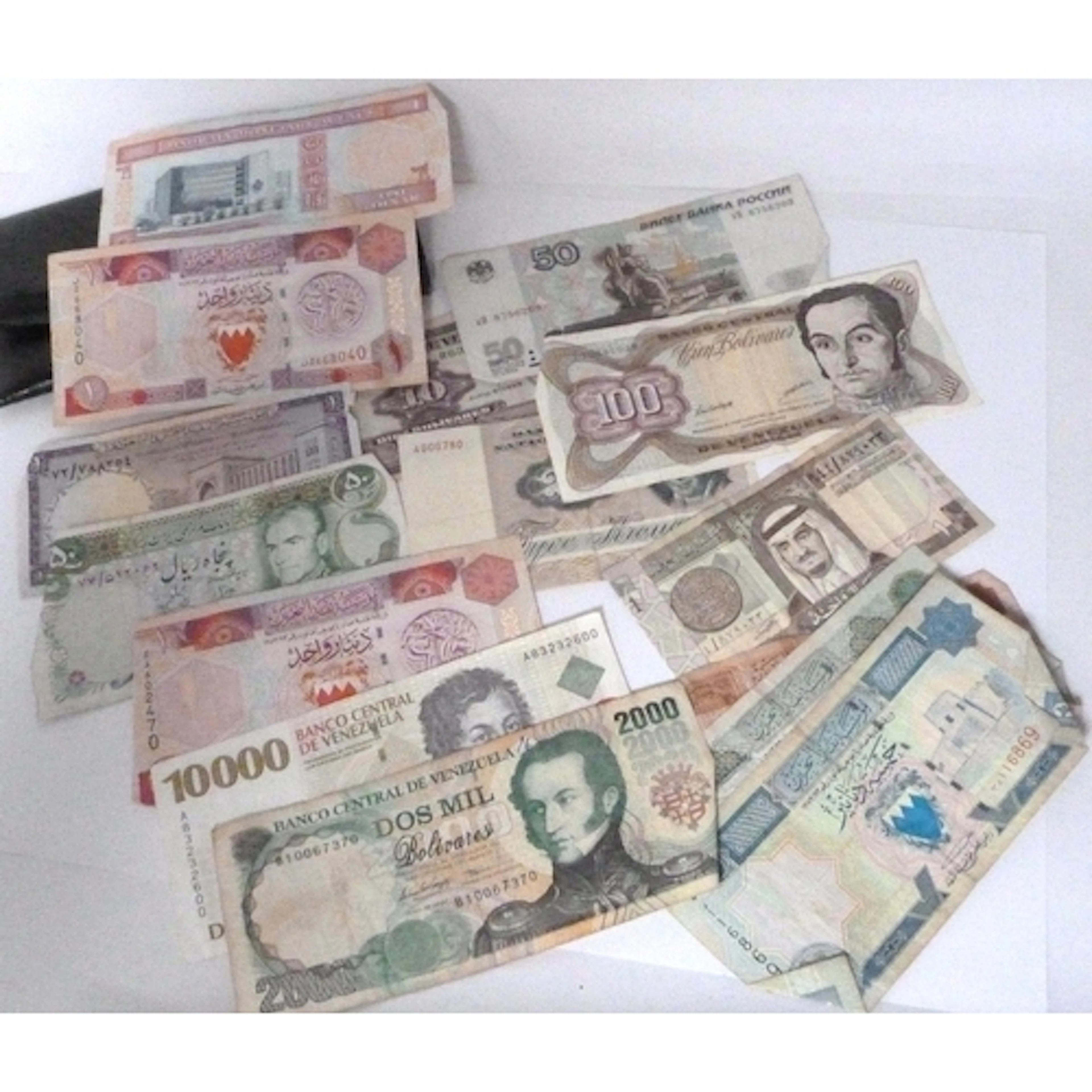 Group of world banknotes to include Saudi Arabia, Venezuela,...