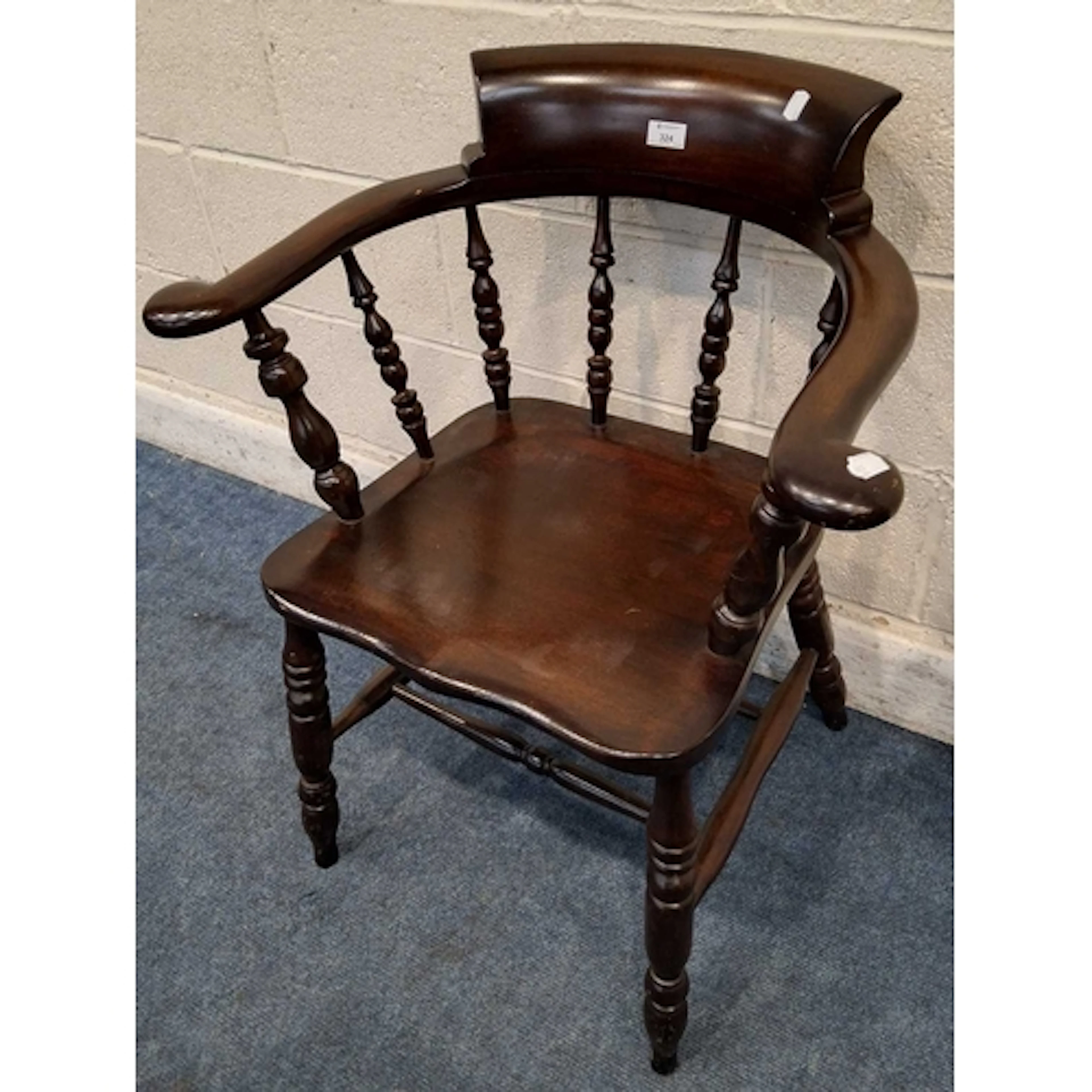 A 20TH CENTURY STAINED MAHOGANY BOW TOP CAPTAINS CHAIR, with...