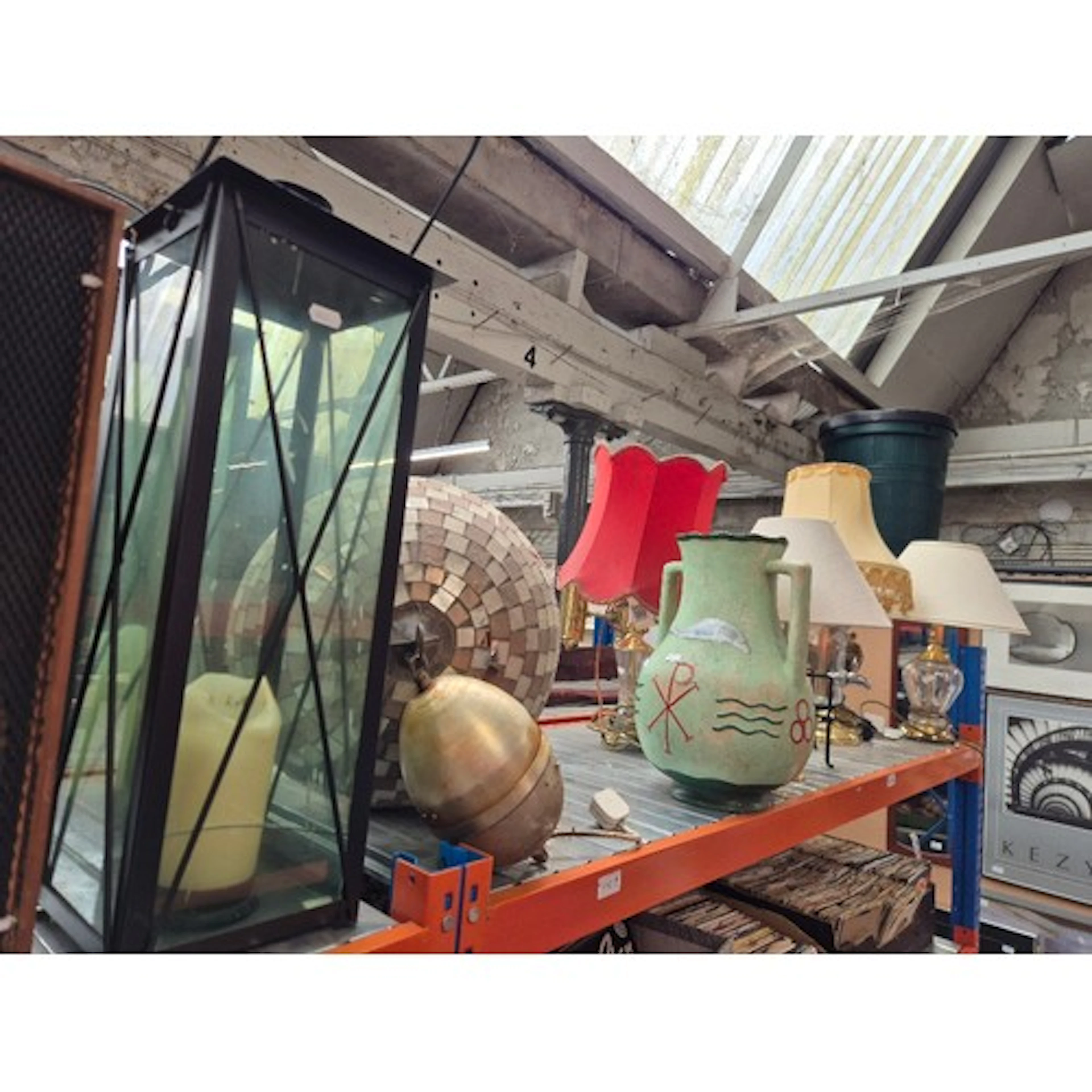A shelf of table lamps including glitter ball, brass, large ...