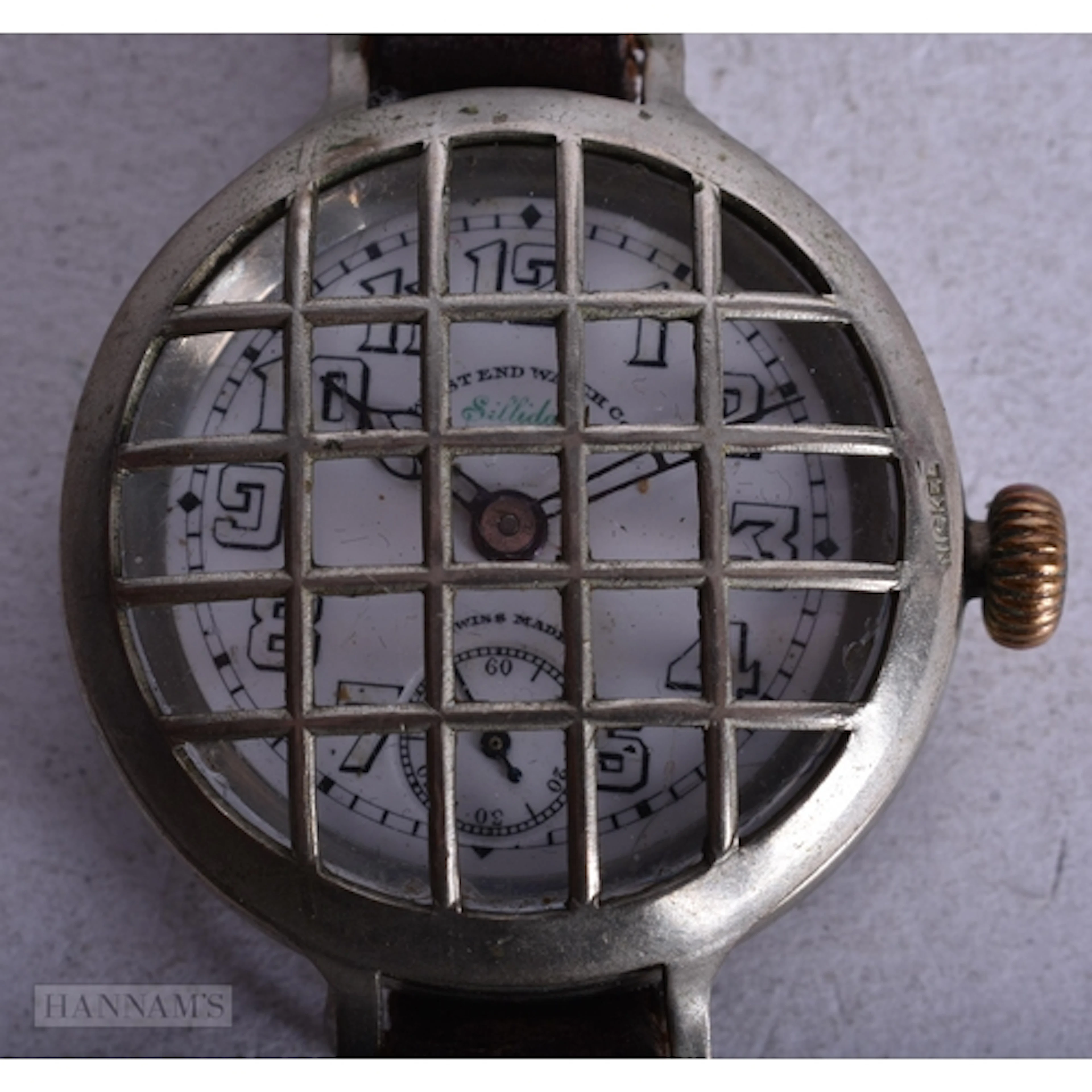 A WEST END WATCH COMPANY FACE GRILL WRIST WATCH. Running. 3....