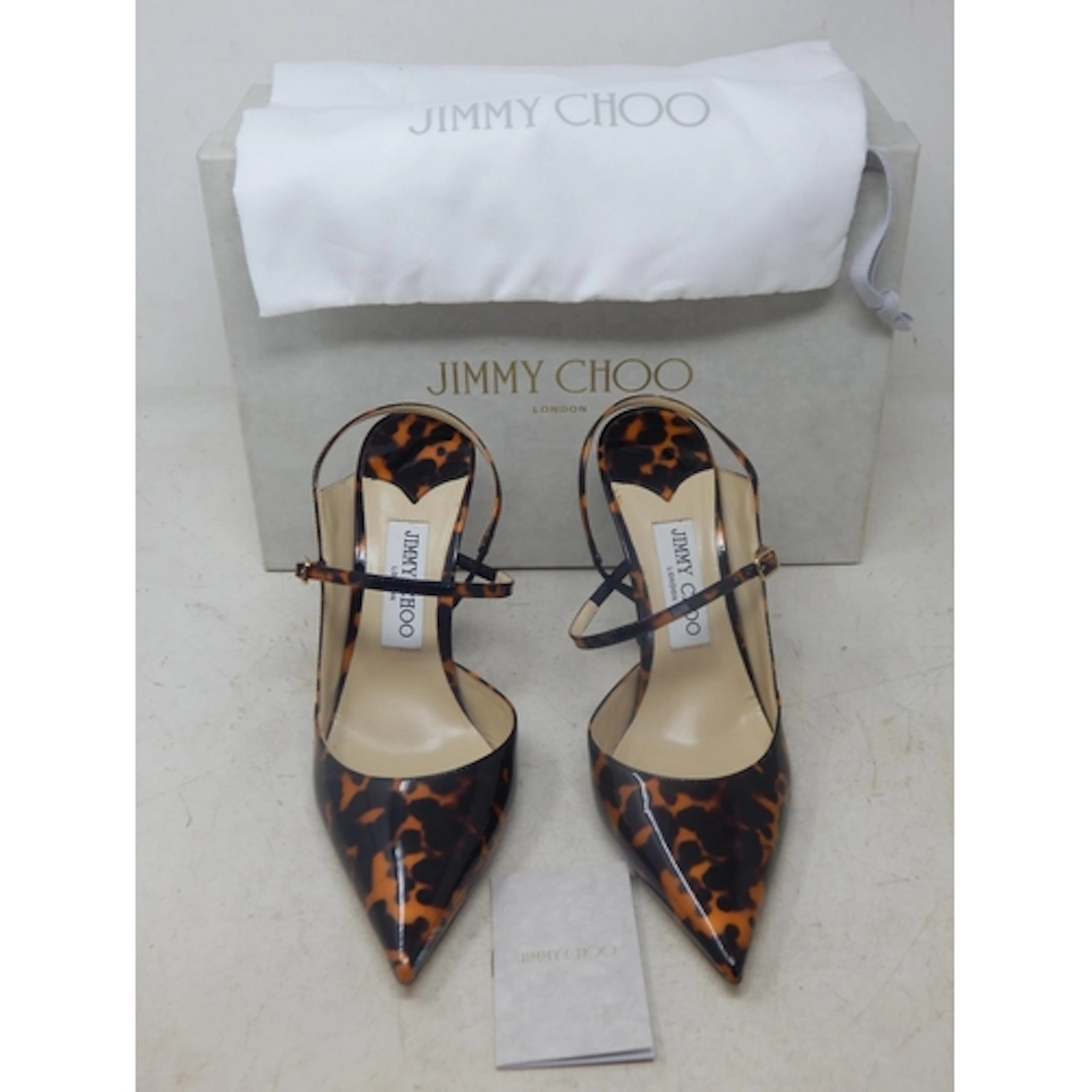 JIMMY CHOO: A Pair of Jimmy Choo Cognac Mix Patent Tortoises...