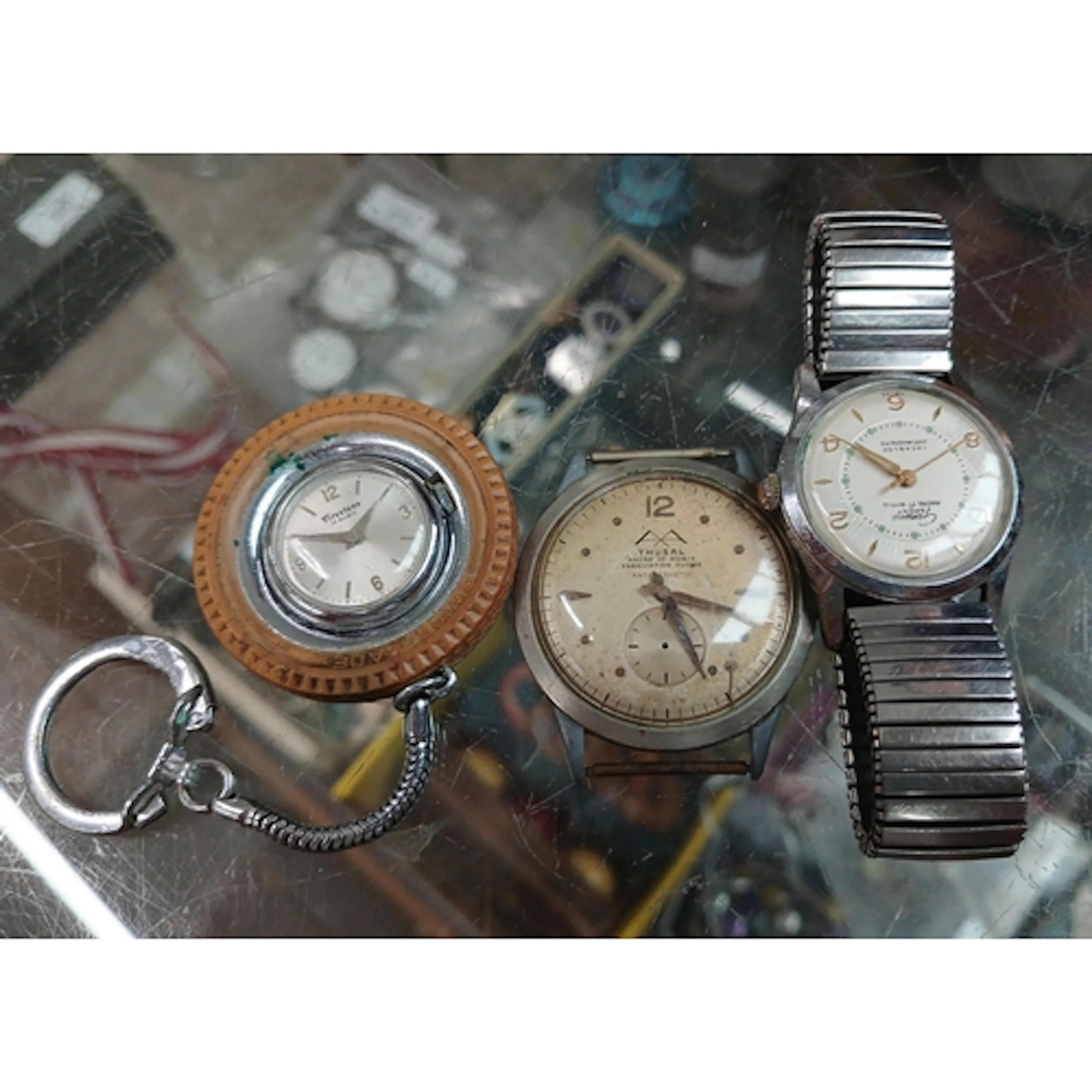 A group of three vintage watches.