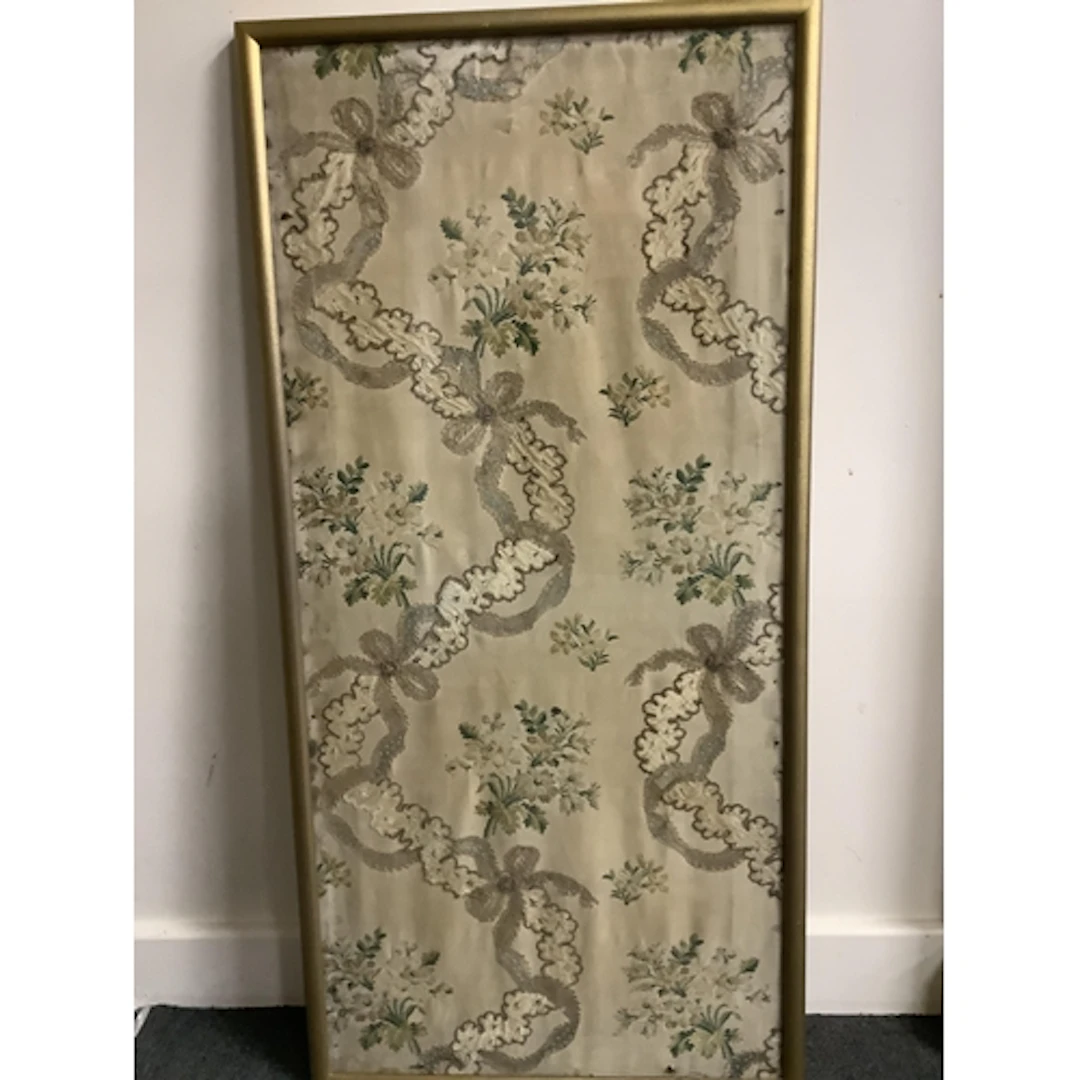 An early 19th century silk brocade framed sample, with hand ...