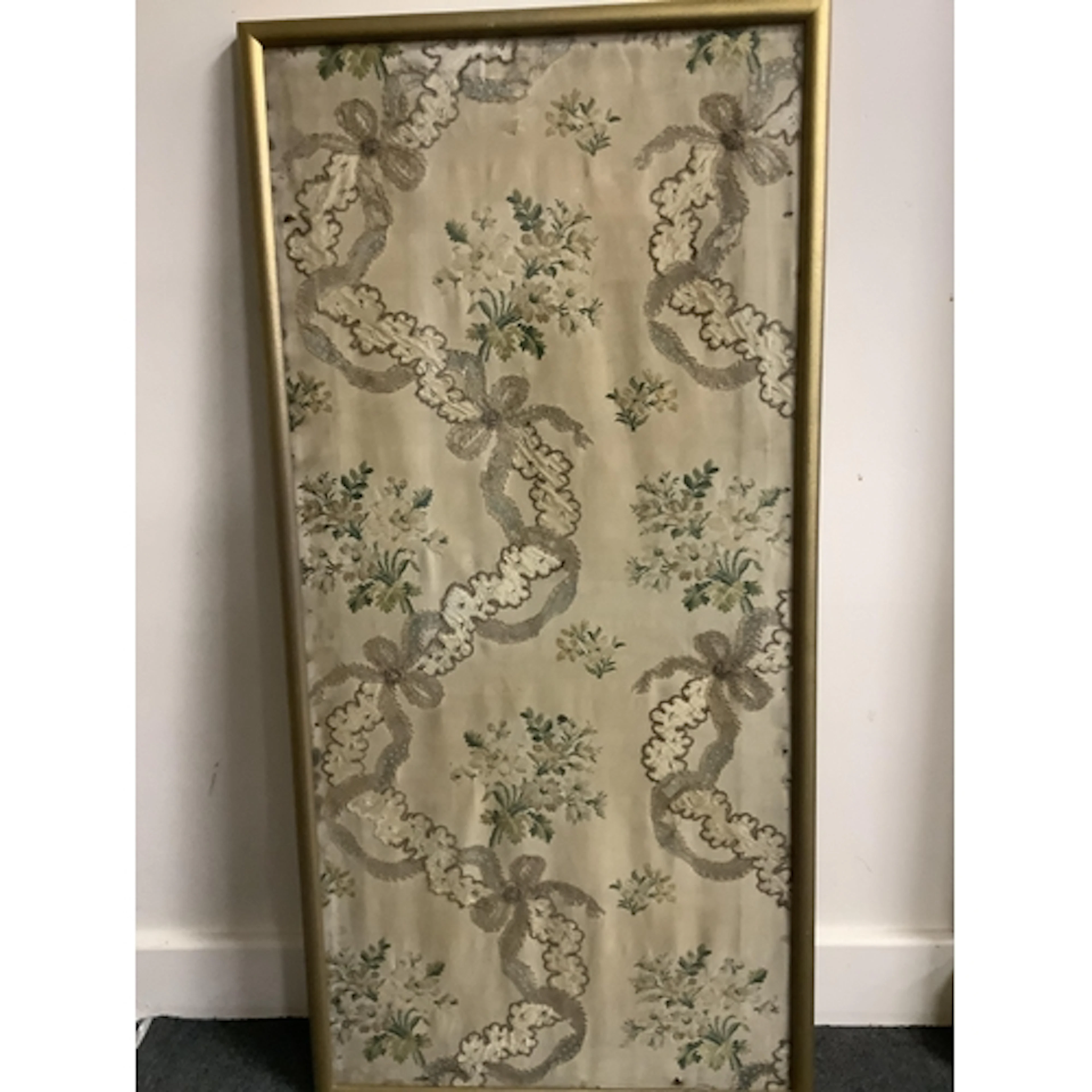 An early 19th century silk brocade framed sample, with hand ...