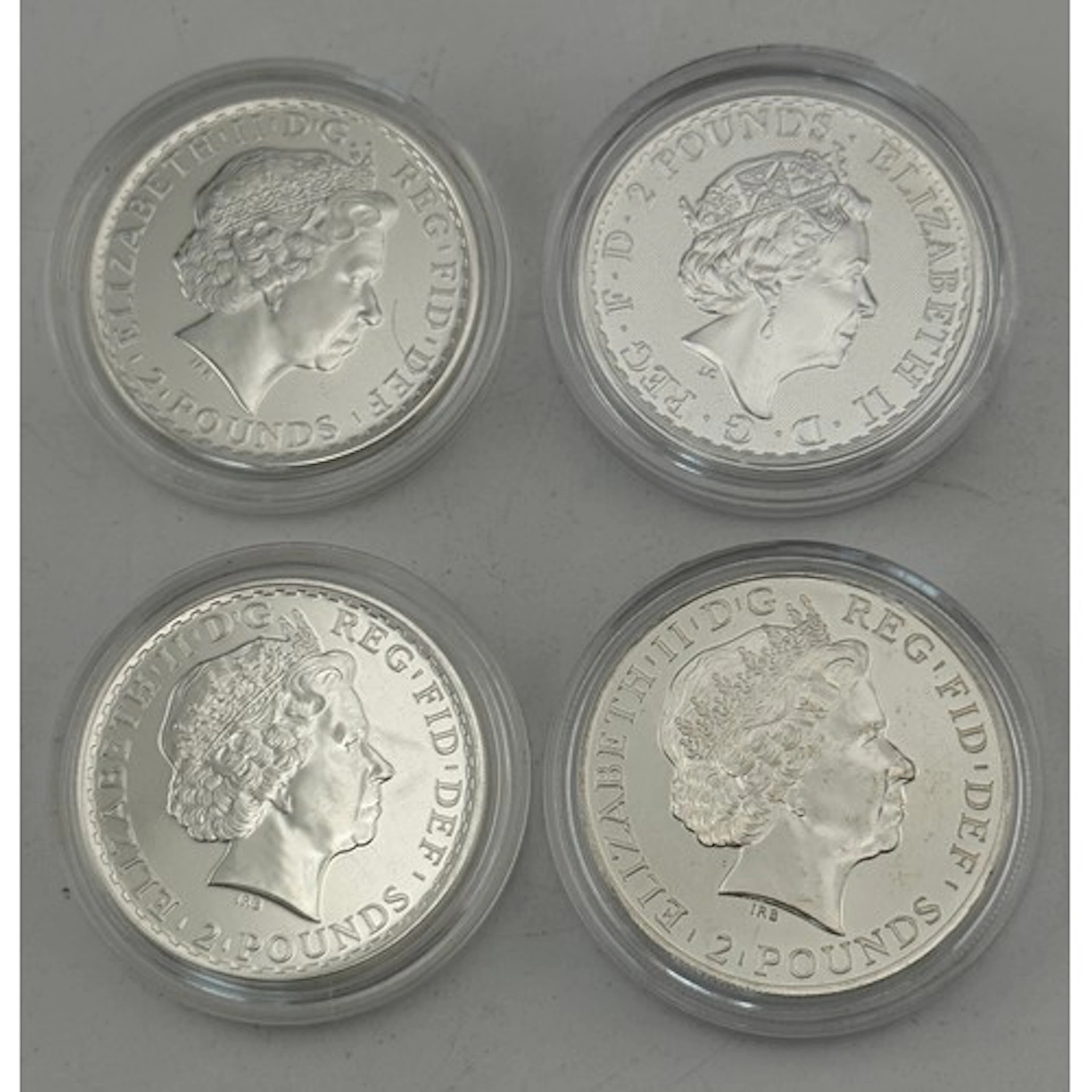 Four 2 Pound 1oz Britannia 999 Fine Silver coins, dates incl...