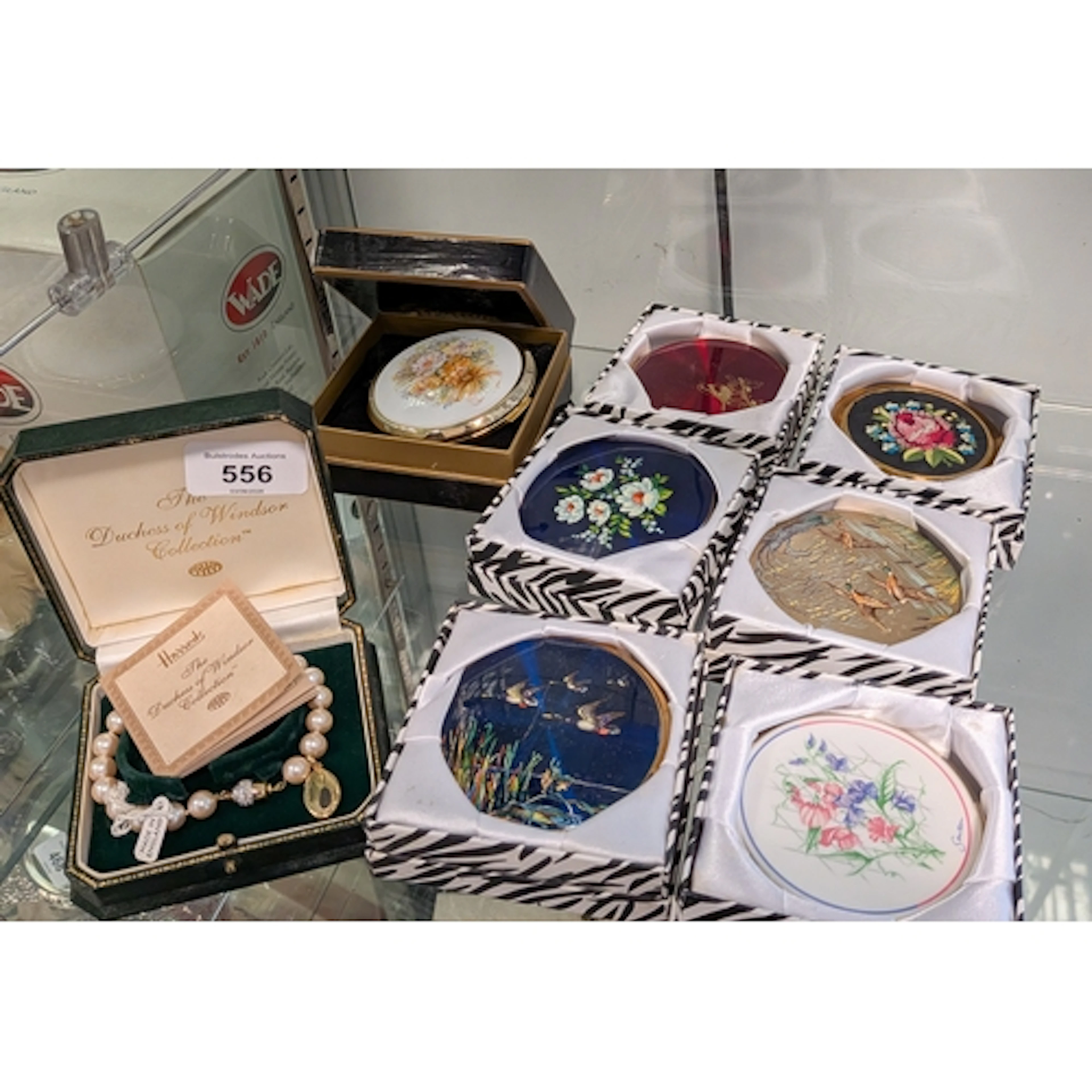 A collection of seven Stratton compacts and a Duchess of Win...