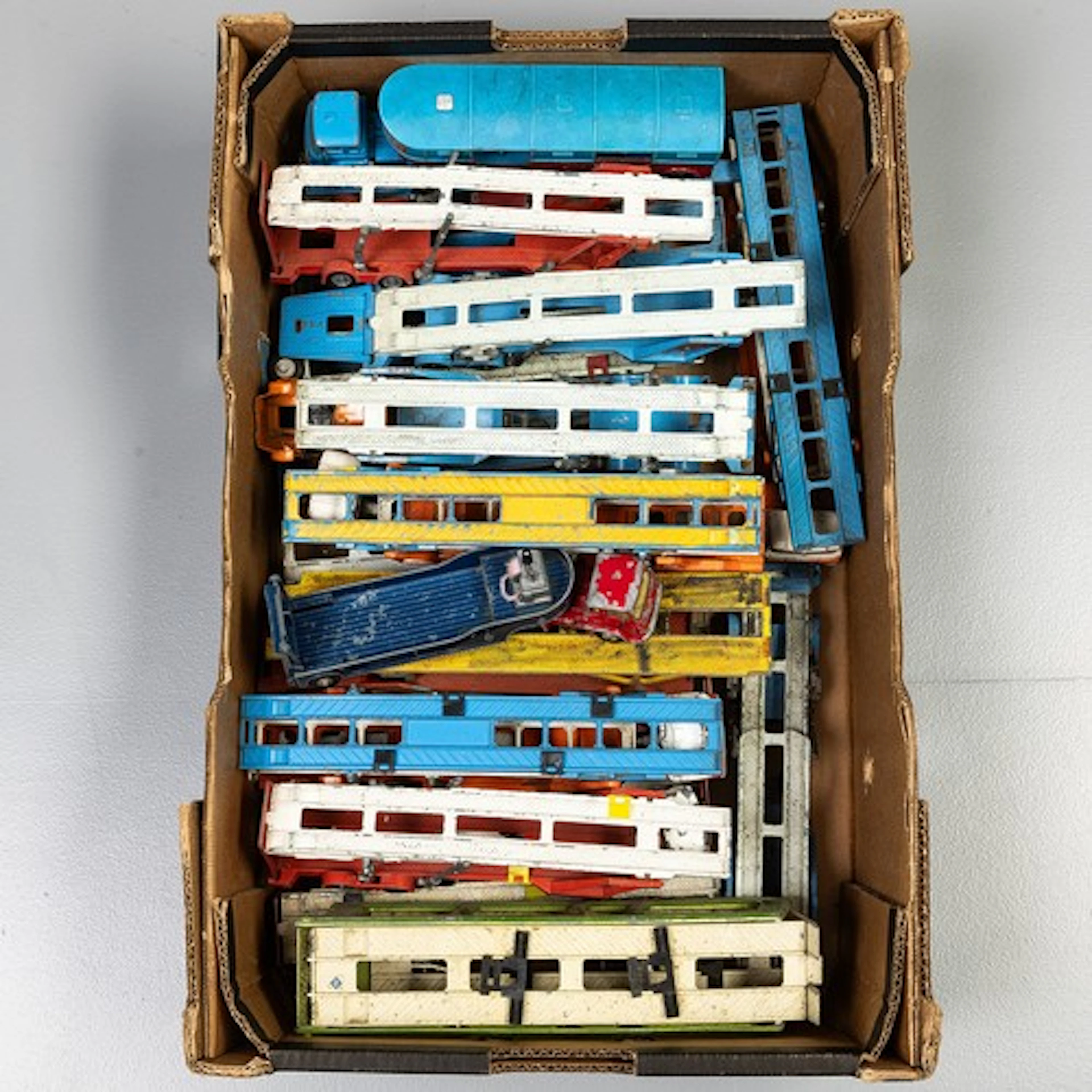 Fruit tray containing unboxed playworn Dinky/Corgi car carri...