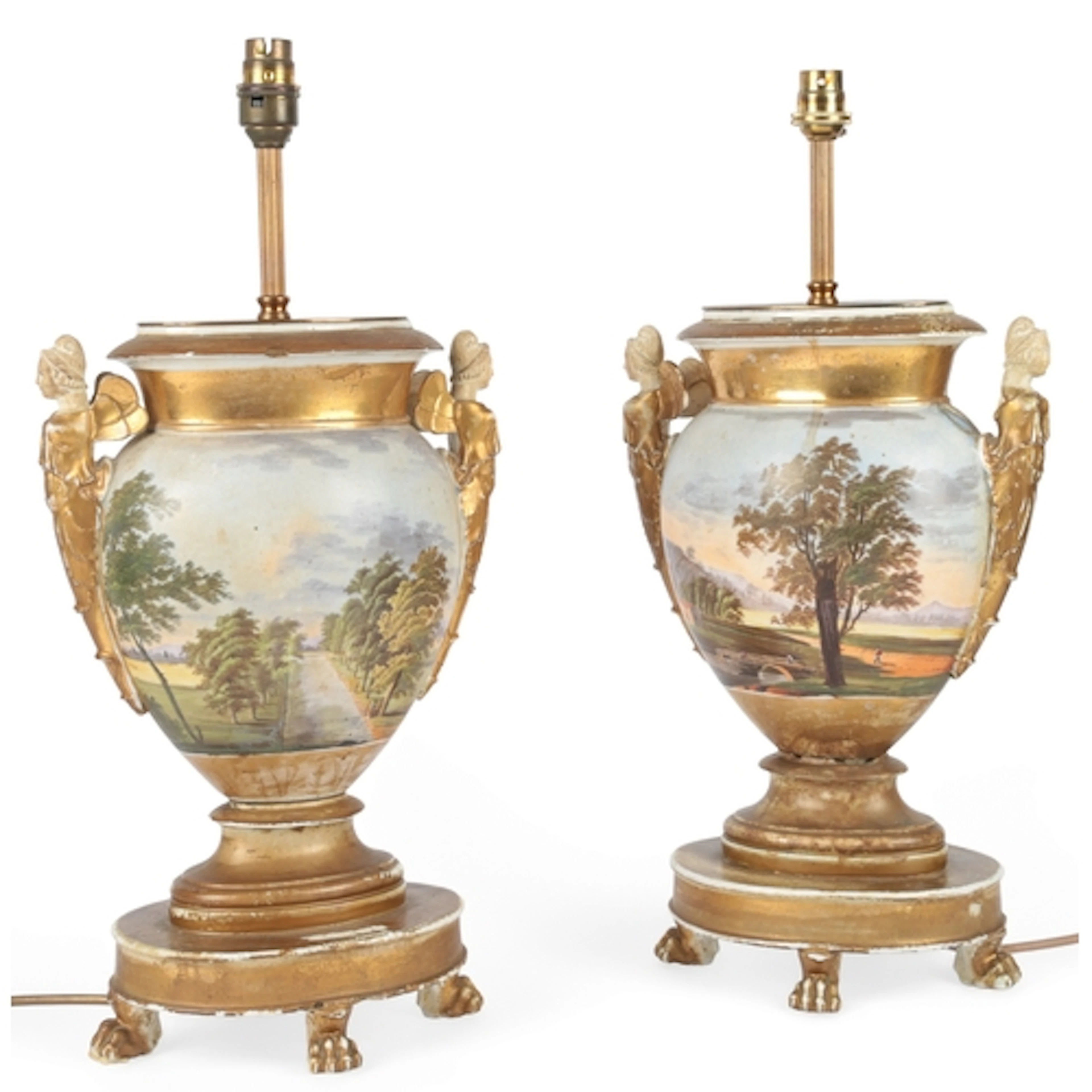 A pair of Paris porcelain landscape painted urns, adapted as...