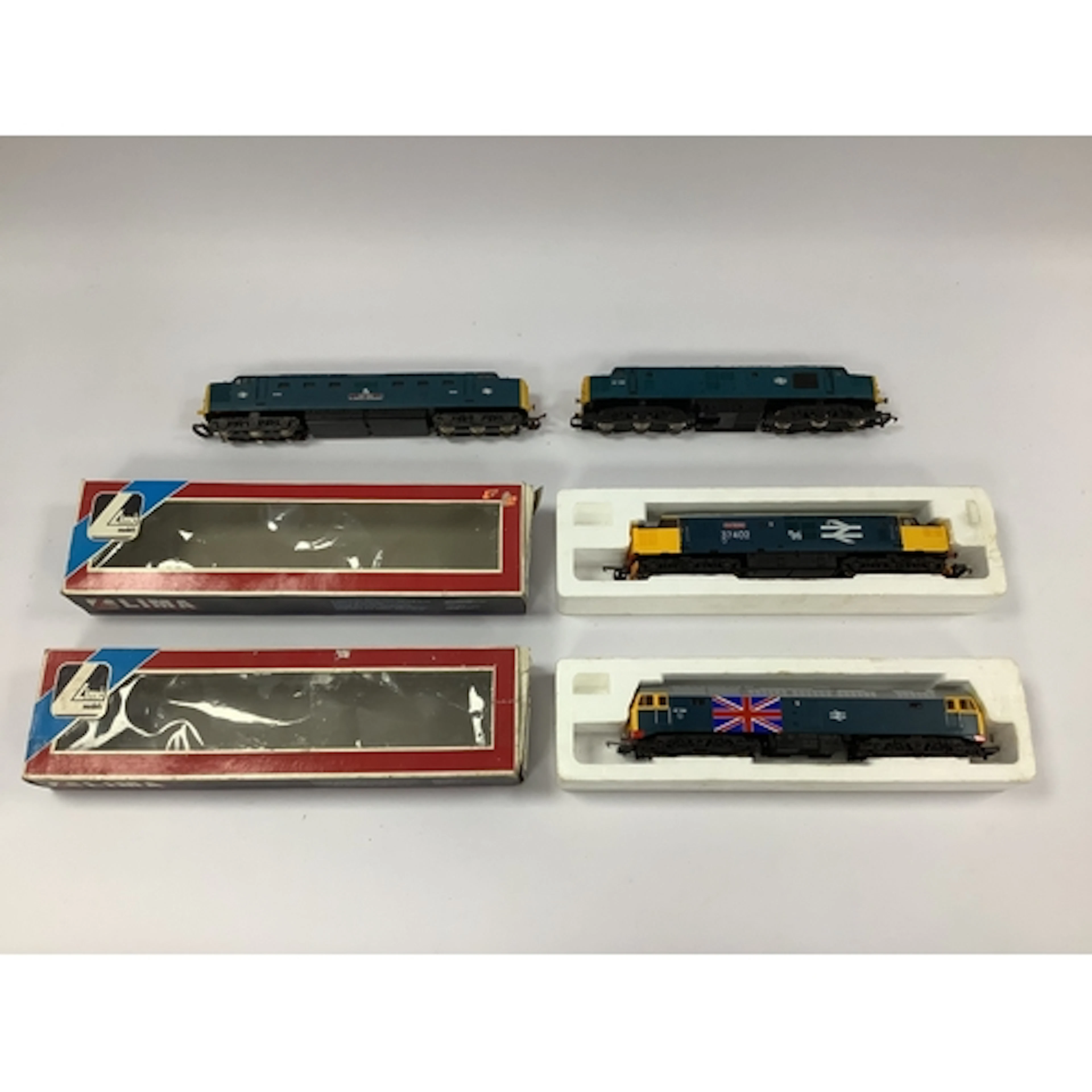 Four 00 gauge BR blue diesels: a boxed Lima Class 47; a boxe...