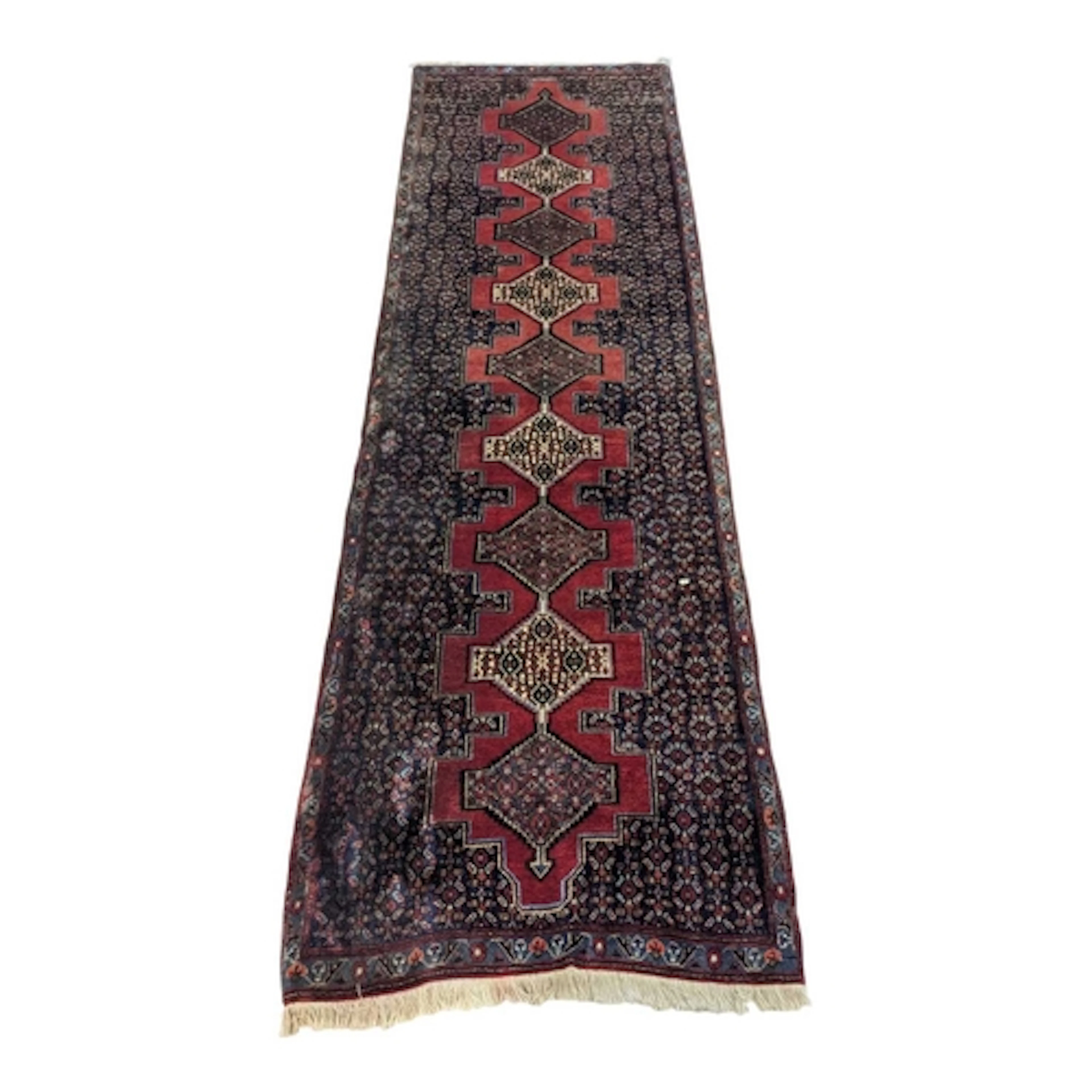 A 20th century Persian Hamadan carpet floor runner rug. The ...