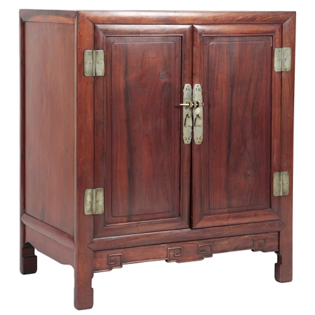 A Chinese huanghuali and hongmu cabinet, 19th century, fitte...