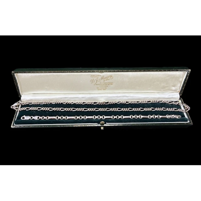 A white metal necklace with fancy links stamped 925 and a si...