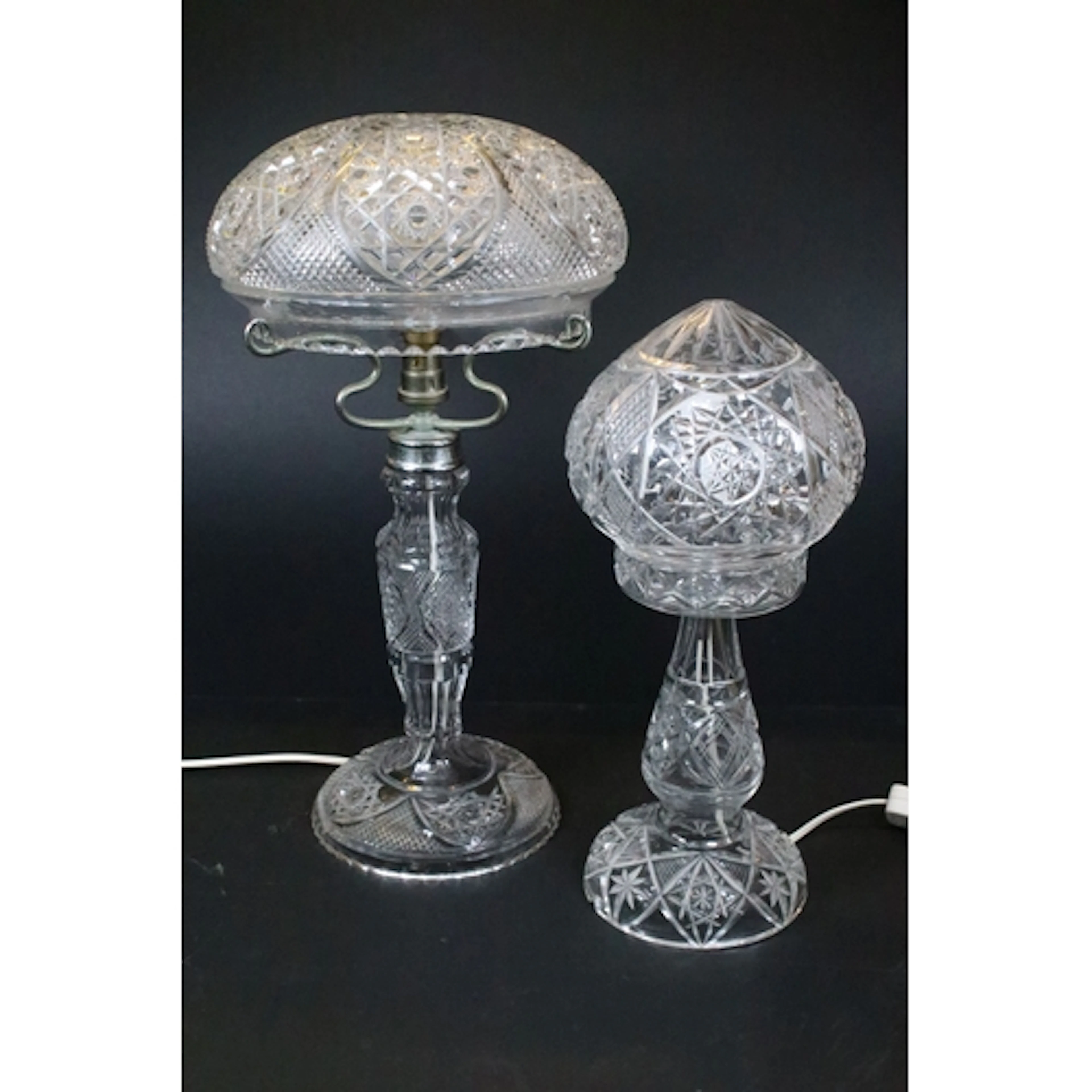 Two 20th century cut glass lamps, having baluster stems with...