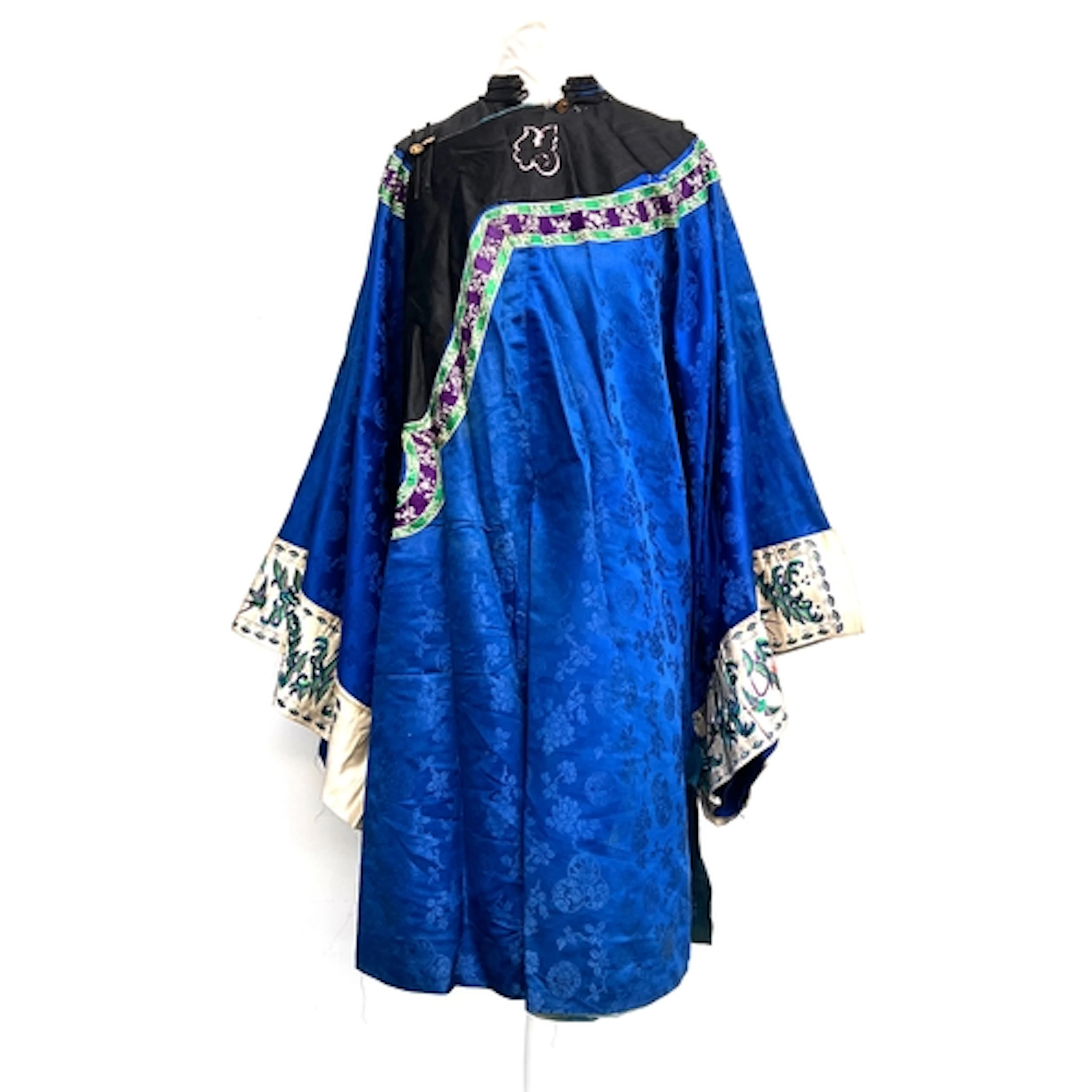 An antique Chinese blue damask silk robe, with a green and p...