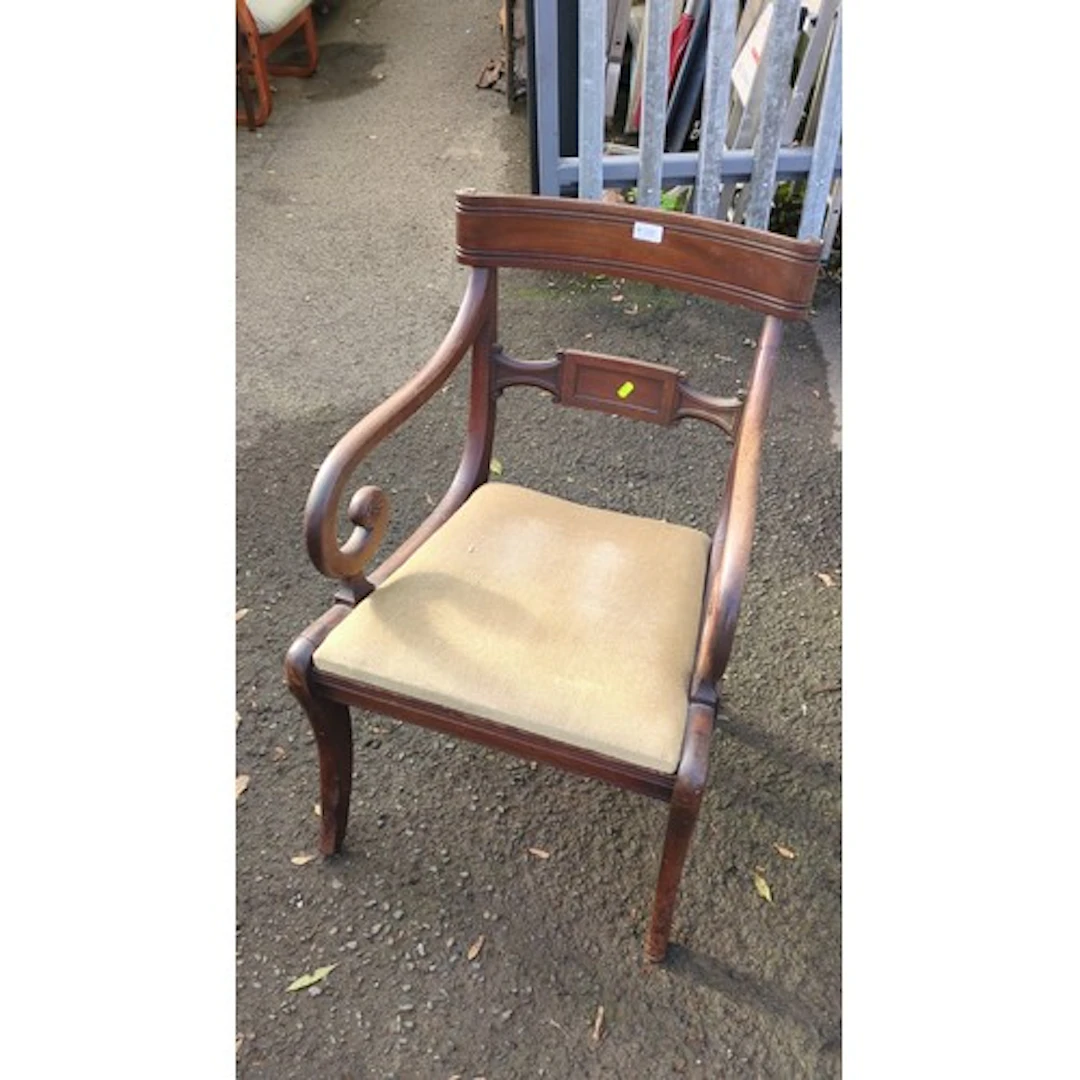 Regency-style mahogany open armchair with a curved crest rai...