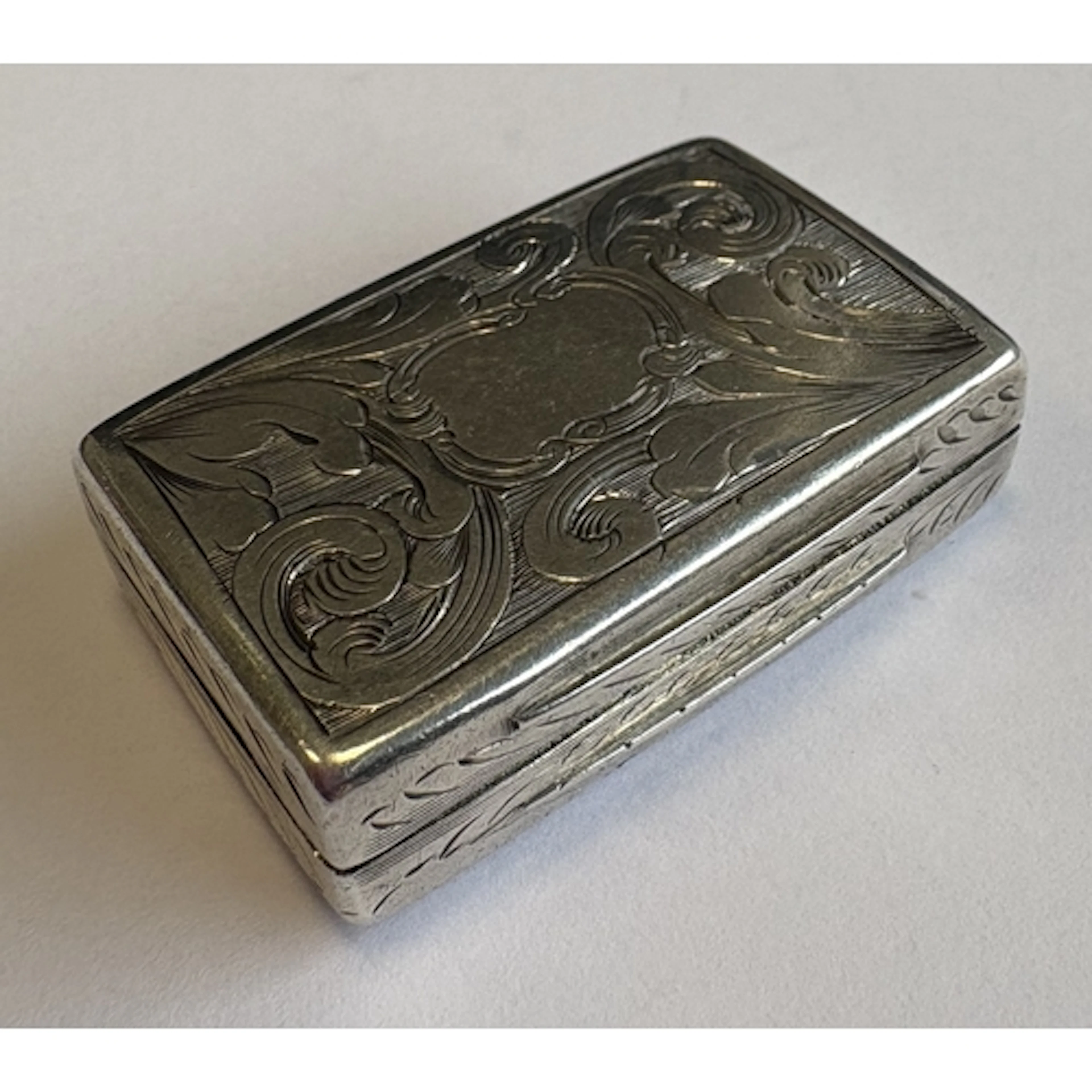 An engraved Victorian silver vinaigrette with gilt interior....