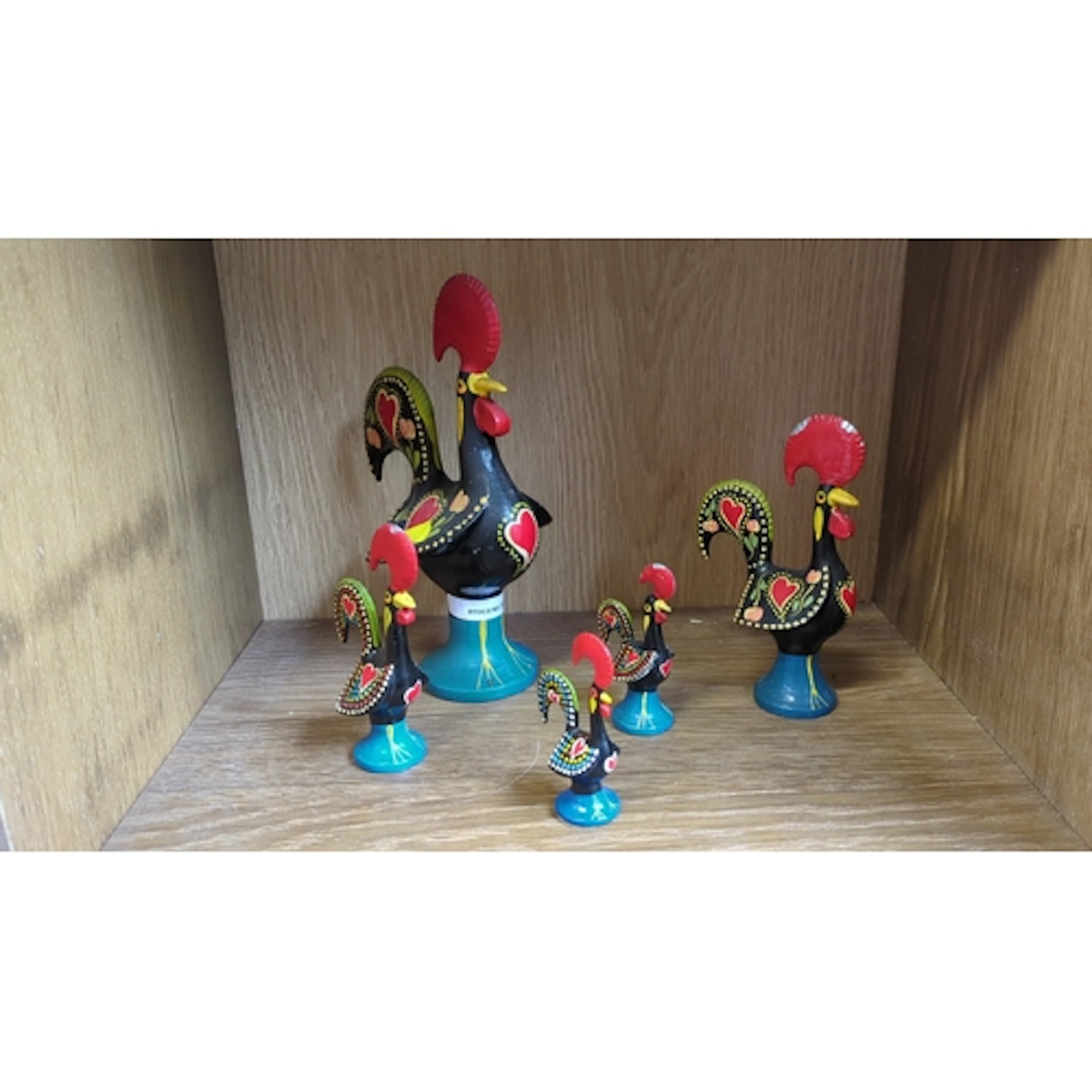 A group of five Portuguese folk-art painted metal cockerel f...