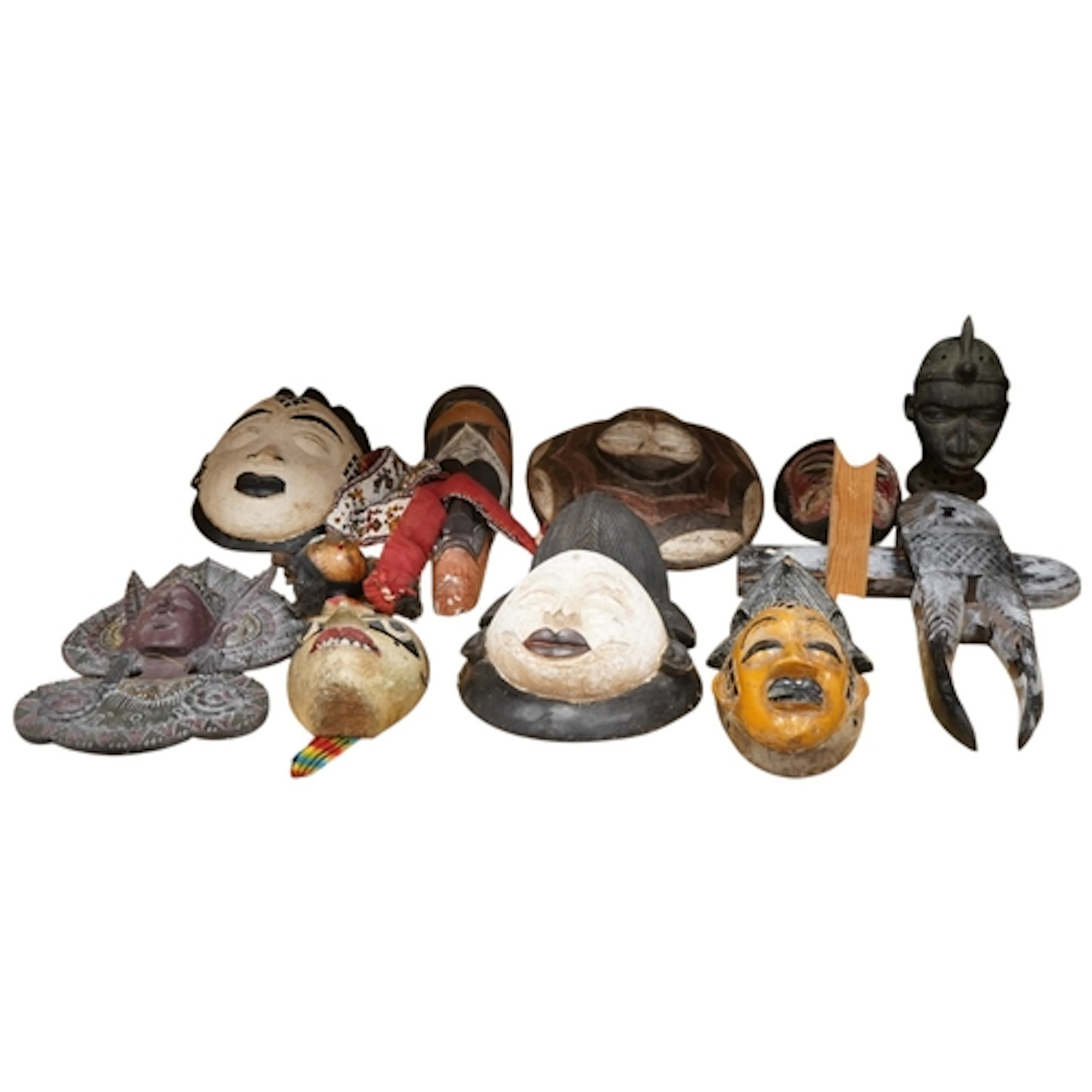 Nine West African painted masks and carvings, a beadwork col...