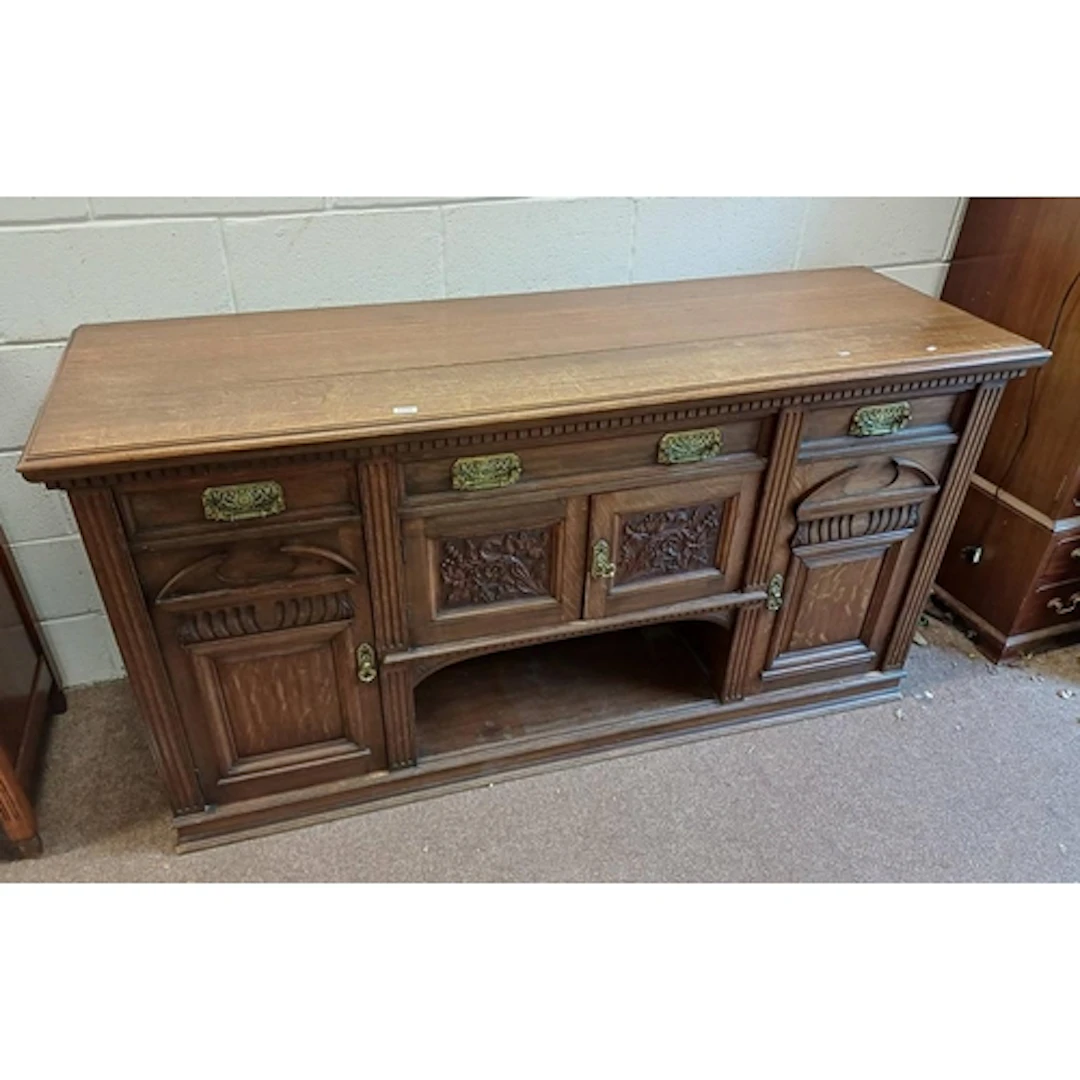 LATE 19TH CENTURY CARVED OAK SIDEBOARD WITH 3 DRAWERS OVER 4...
