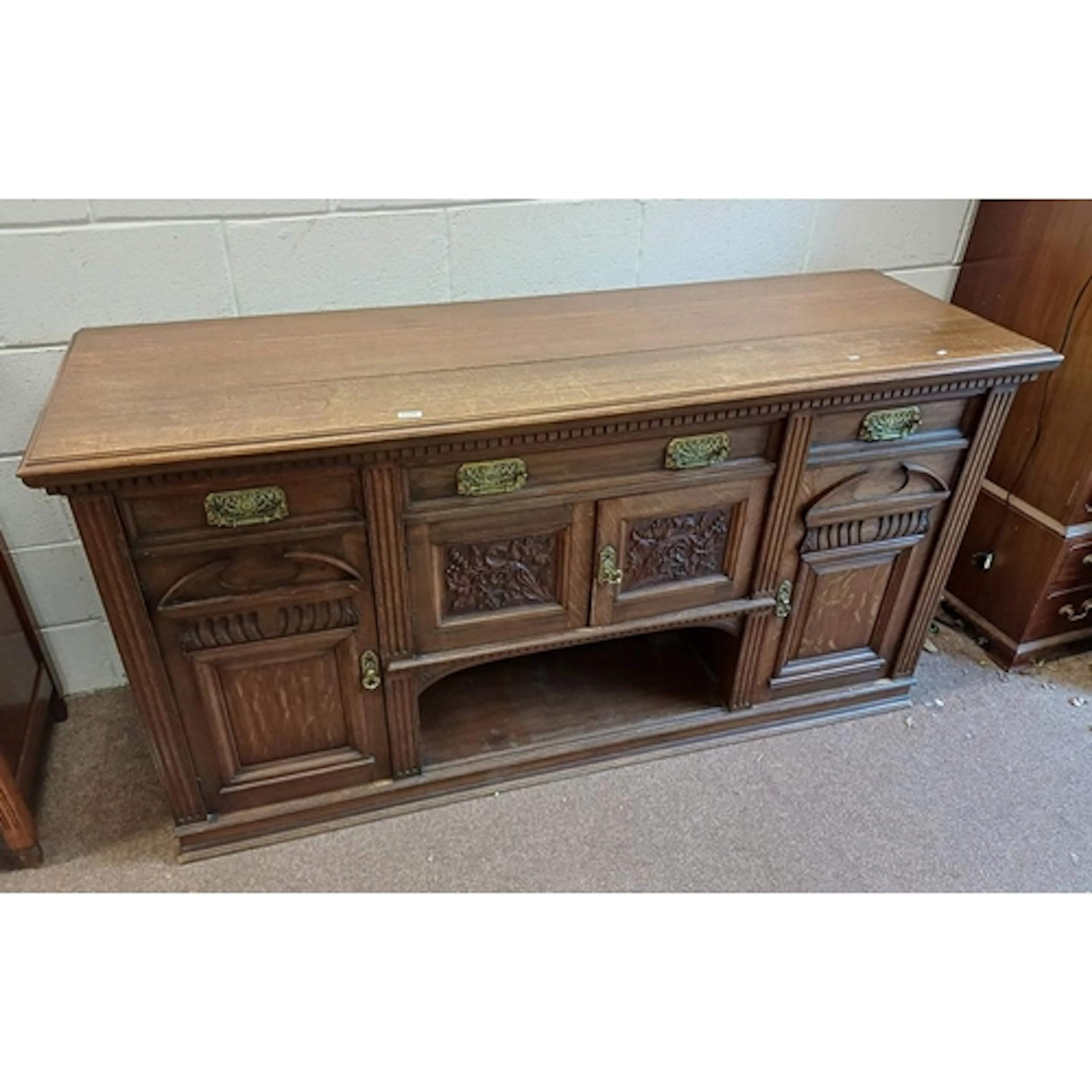 LATE 19TH CENTURY CARVED OAK SIDEBOARD WITH 3 DRAWERS OVER 4...